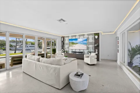 a view of swimming pool with outdoor seating and living room