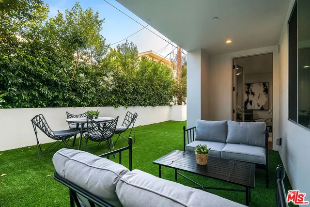 a outdoor living space with furniture and garden