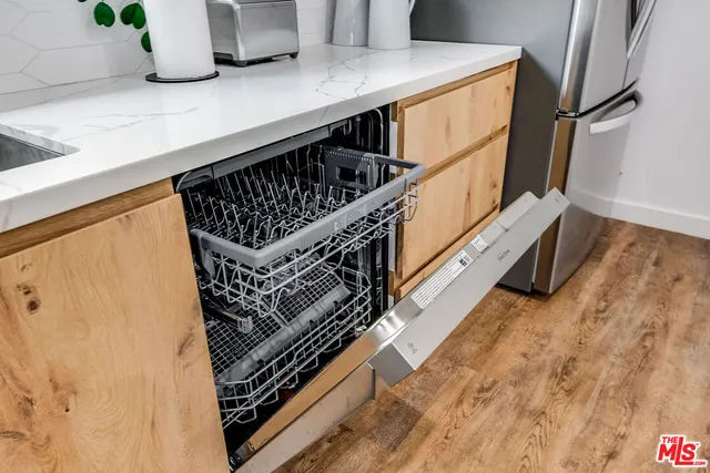 a kitchen with a refrigerator and a sink