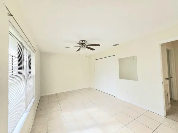 a view of a room with tiles and a window