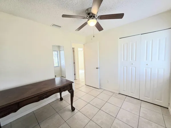 a room with pool table and window