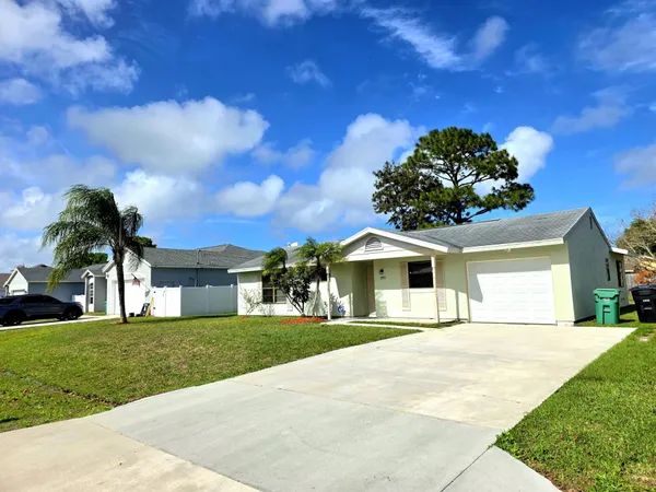 front view of a house with a yard