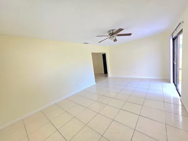 wooden floor in a hall with a window