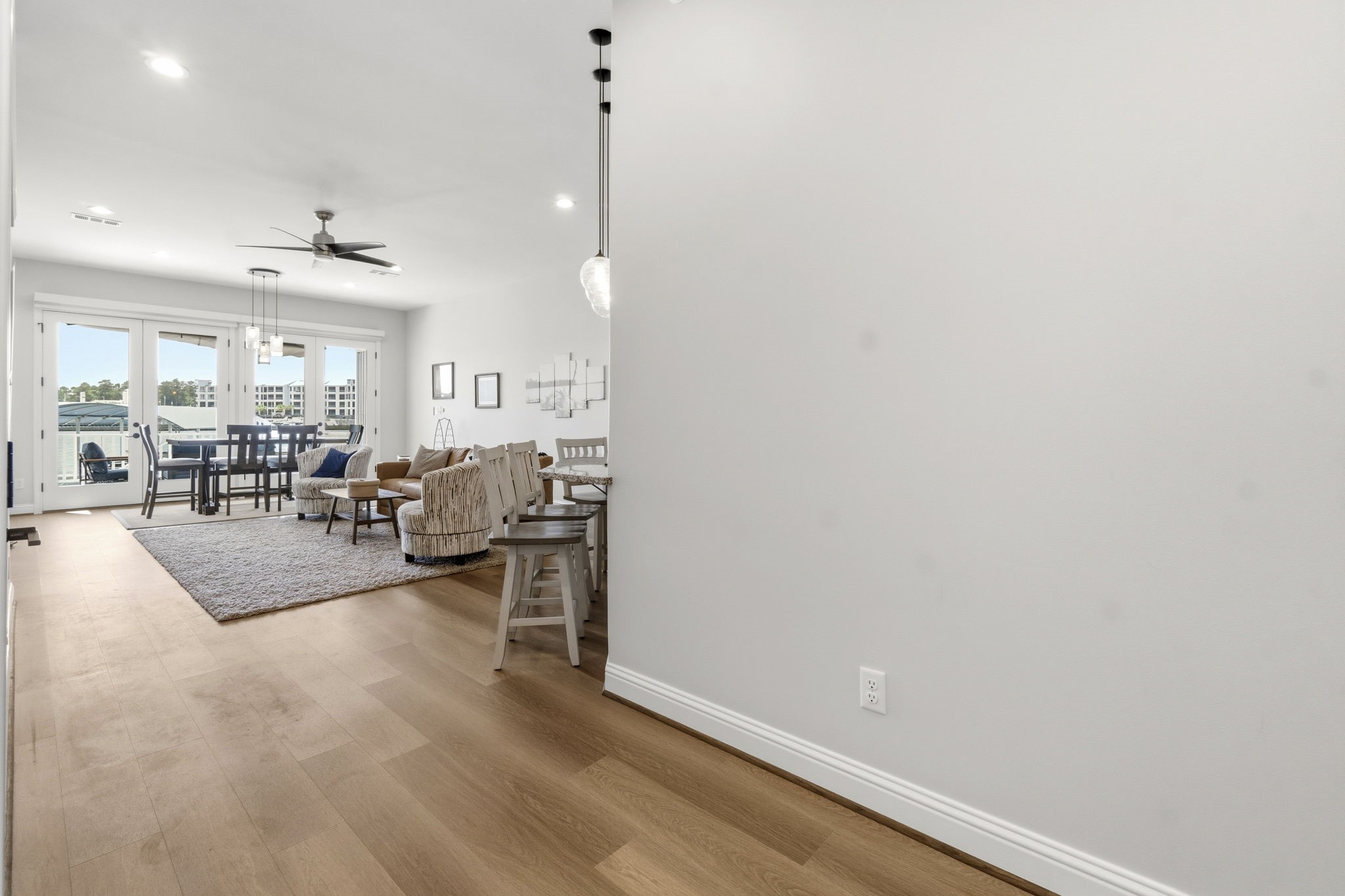 2 Key Harbour Conroe, TX 77356 - Photo 9 of 41 a living room with furniture and a wooden floor
