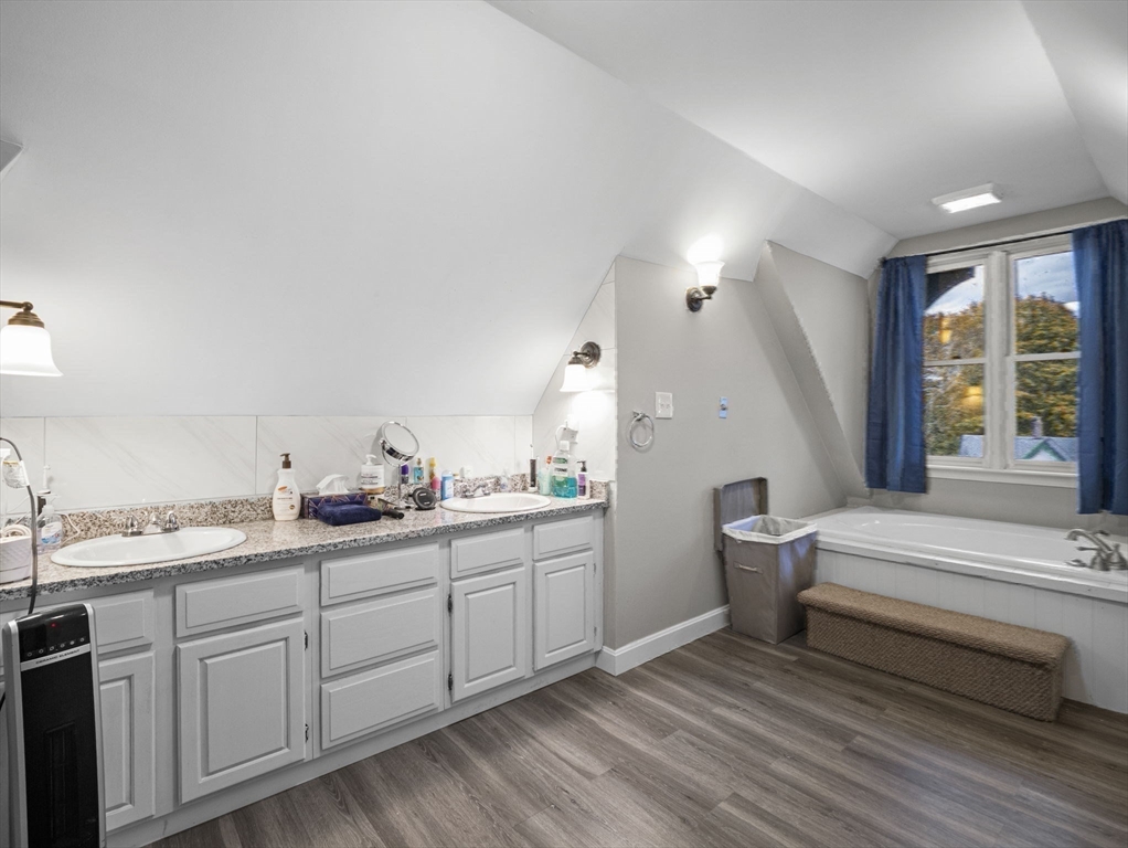 35 Cedar Street, Unit 6 Gardner, MA 01440 - Photo 13 of 39 a spacious bathroom with a double vanity sink and a window