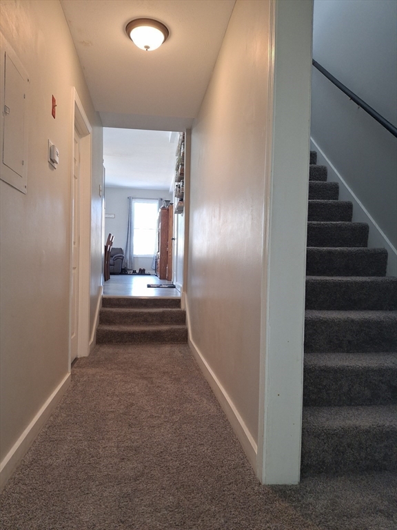 35 Cedar Street, Unit 6 Gardner, MA 01440 - Photo 20 of 39 a view of a hallway with wooden floor and staircase