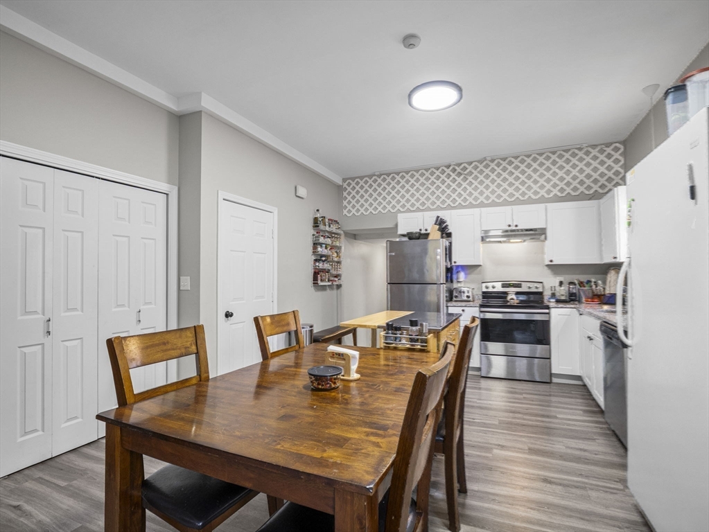 35 Cedar Street, Unit 6 Gardner, MA 01440 - Photo 27 of 39 a view of a dining room with furniture and wooden floor