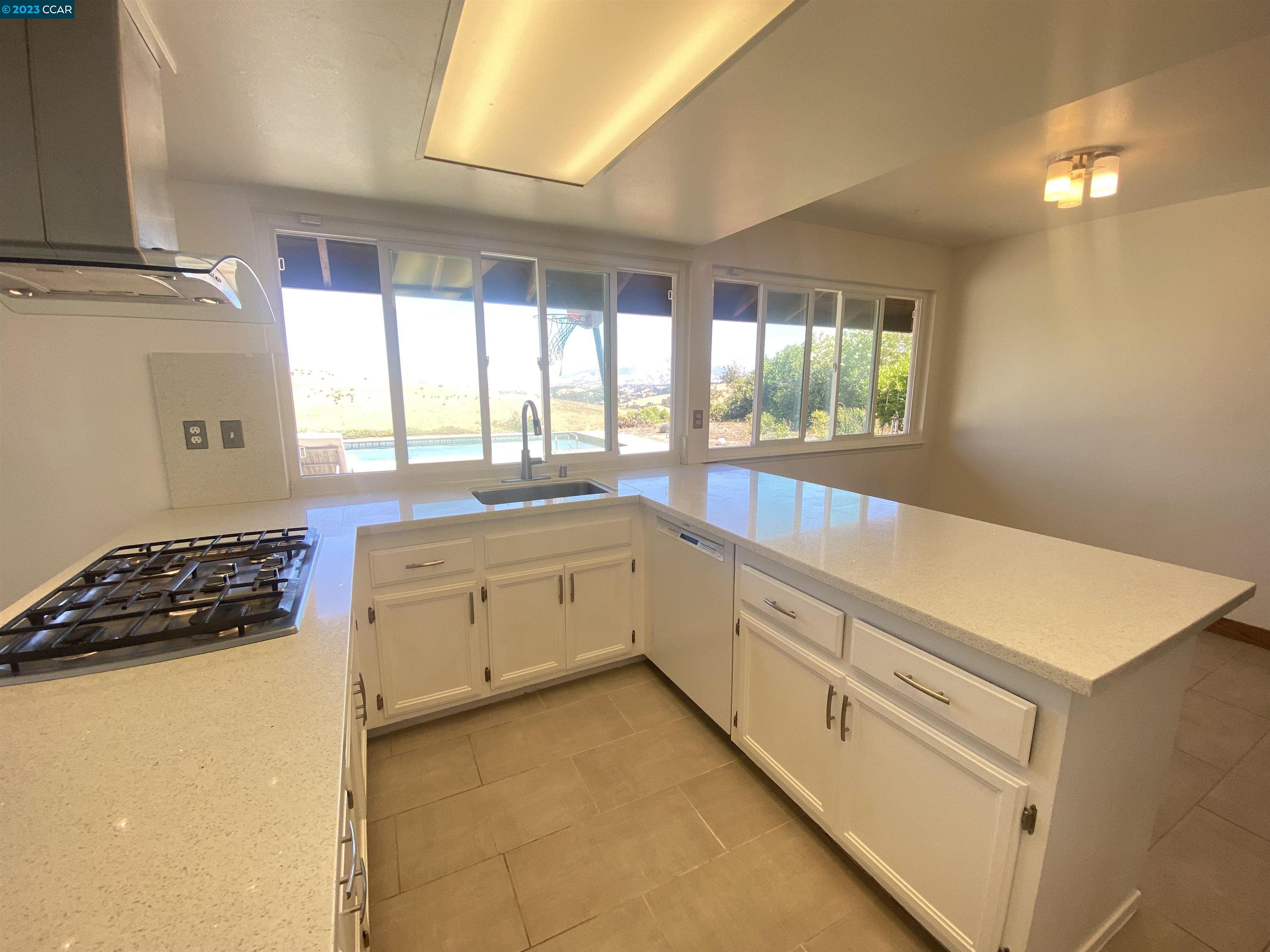 269 Birchwood Drive Moraga, CA 94556 - Photo 13 of 43 a kitchen that has a sink and a stove
