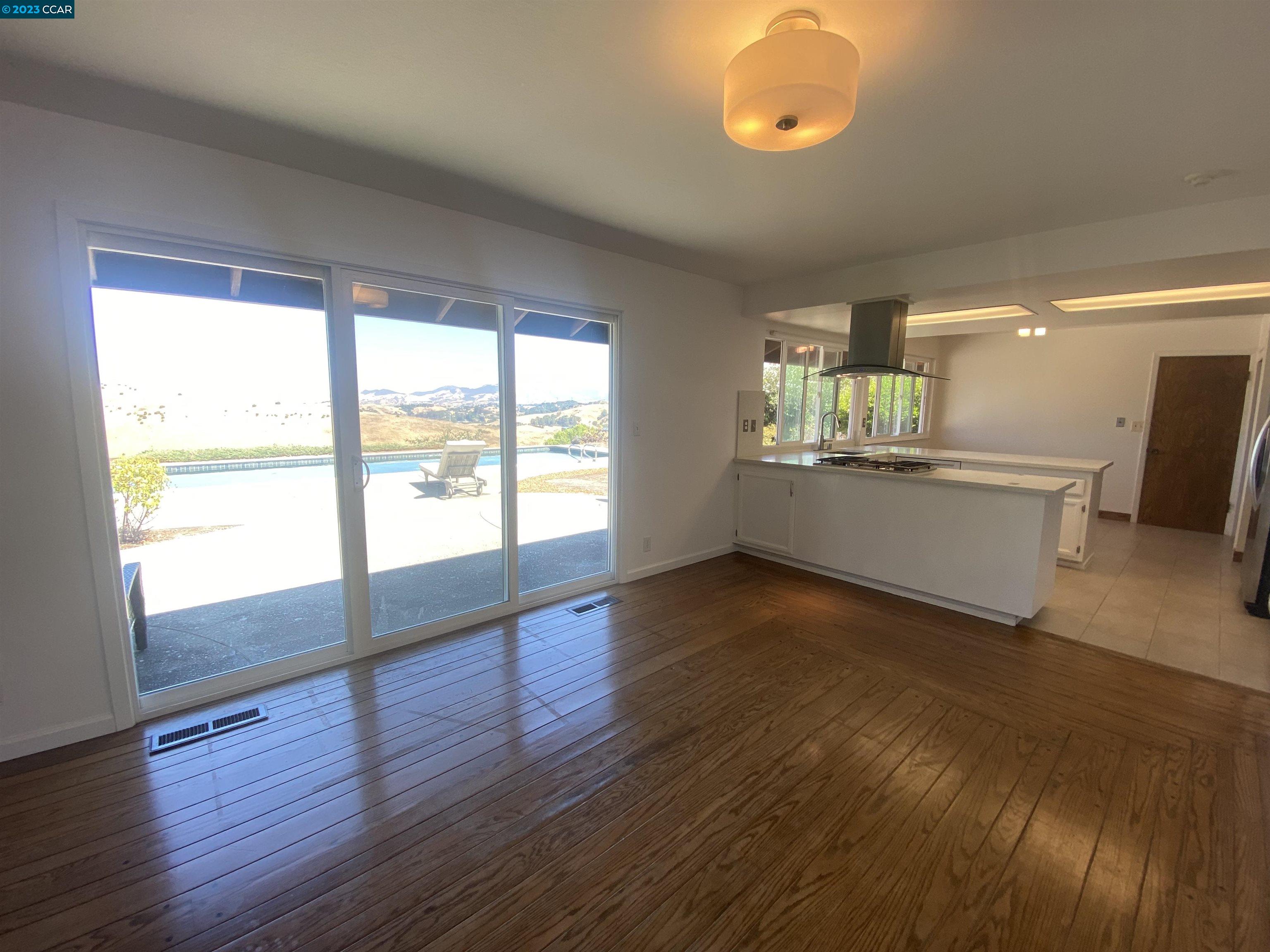 269 Birchwood Drive Moraga, CA 94556 - Photo 18 of 43 a view of an empty room with a window and wooden floor