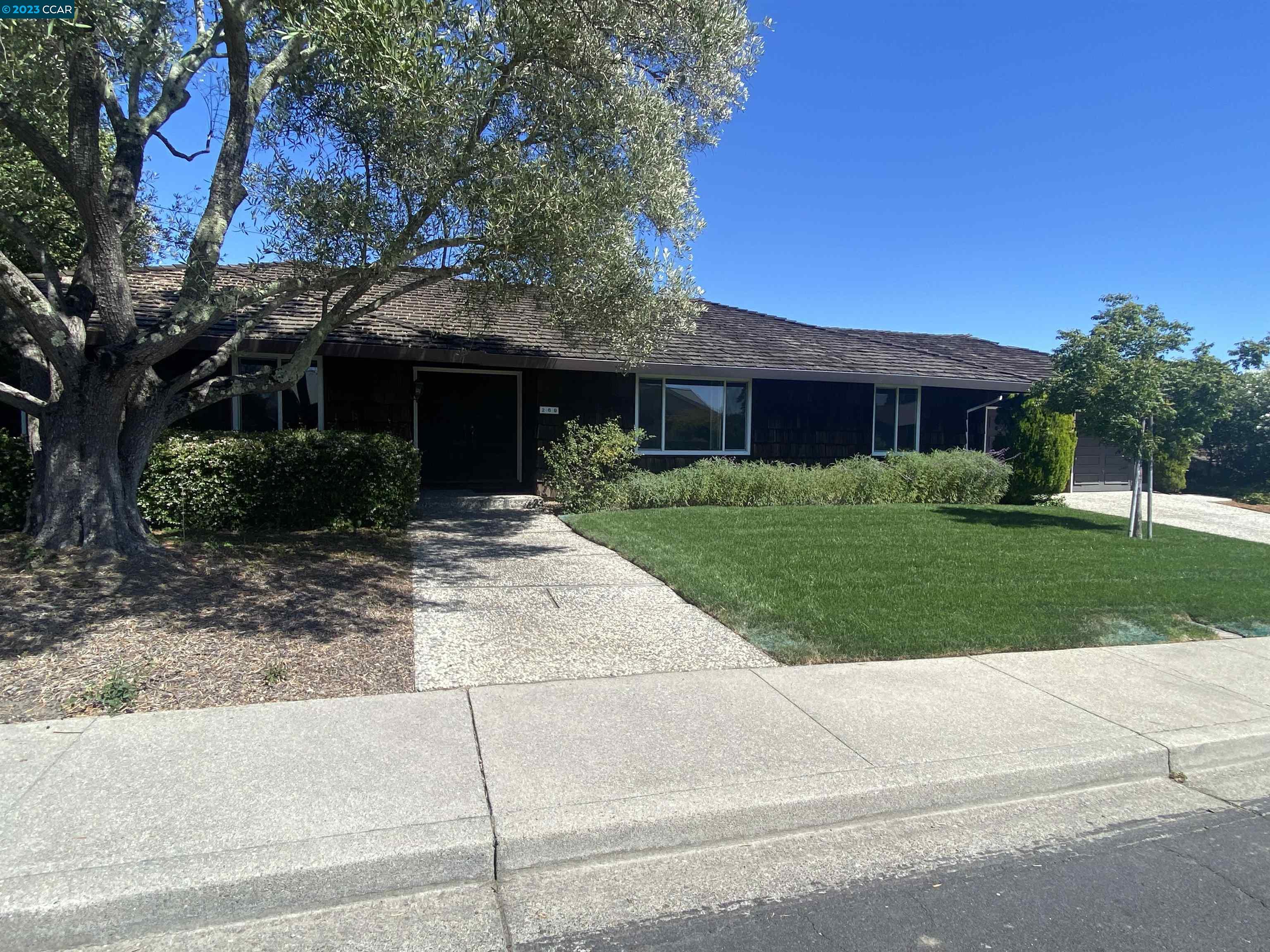 269 Birchwood Drive Moraga, CA 94556 - Photo 2 of 43 a front view of house with yard and green space