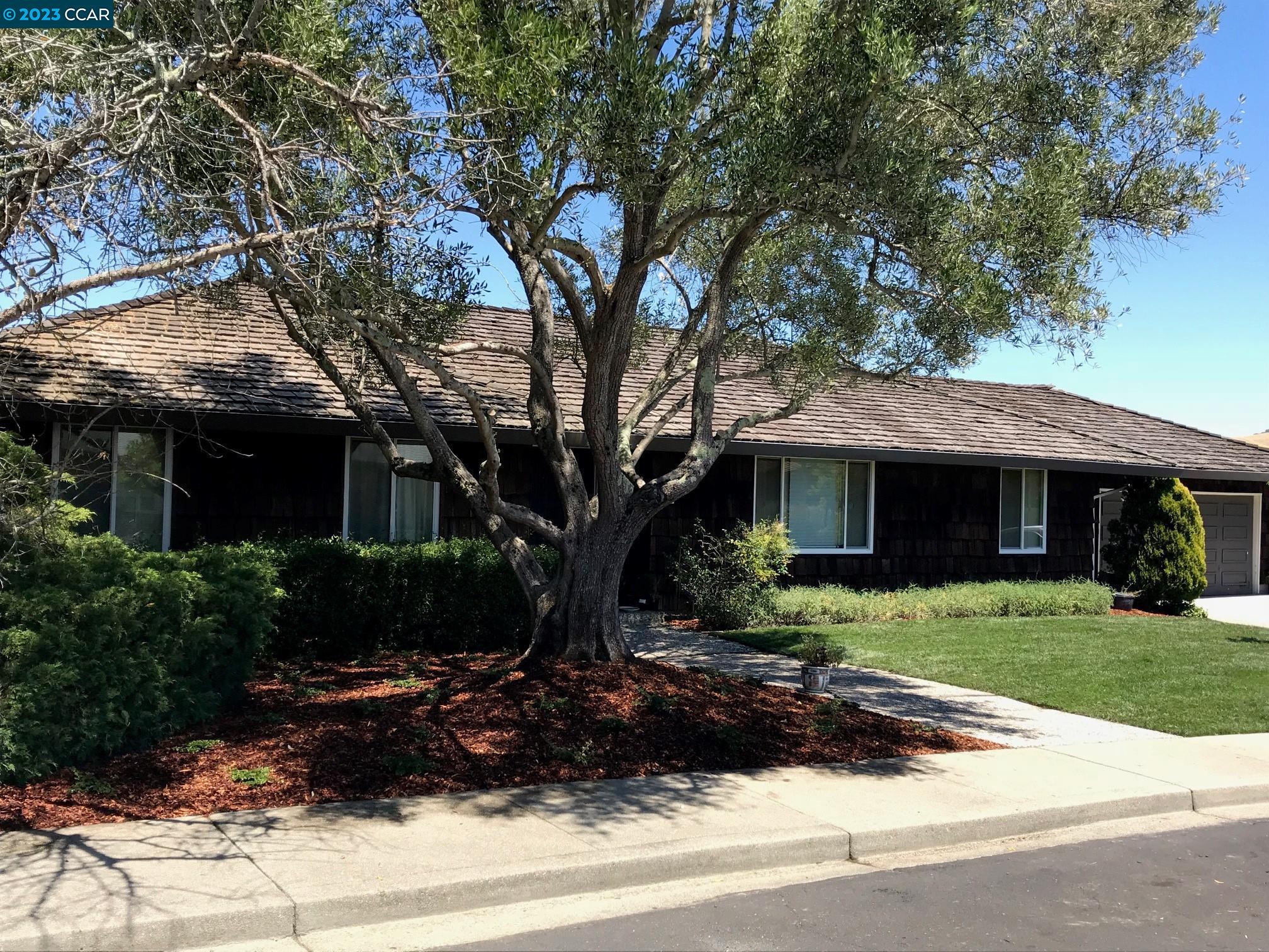 269 Birchwood Drive Moraga, CA 94556 - Photo 24 of 43 a front view of a house with a garden