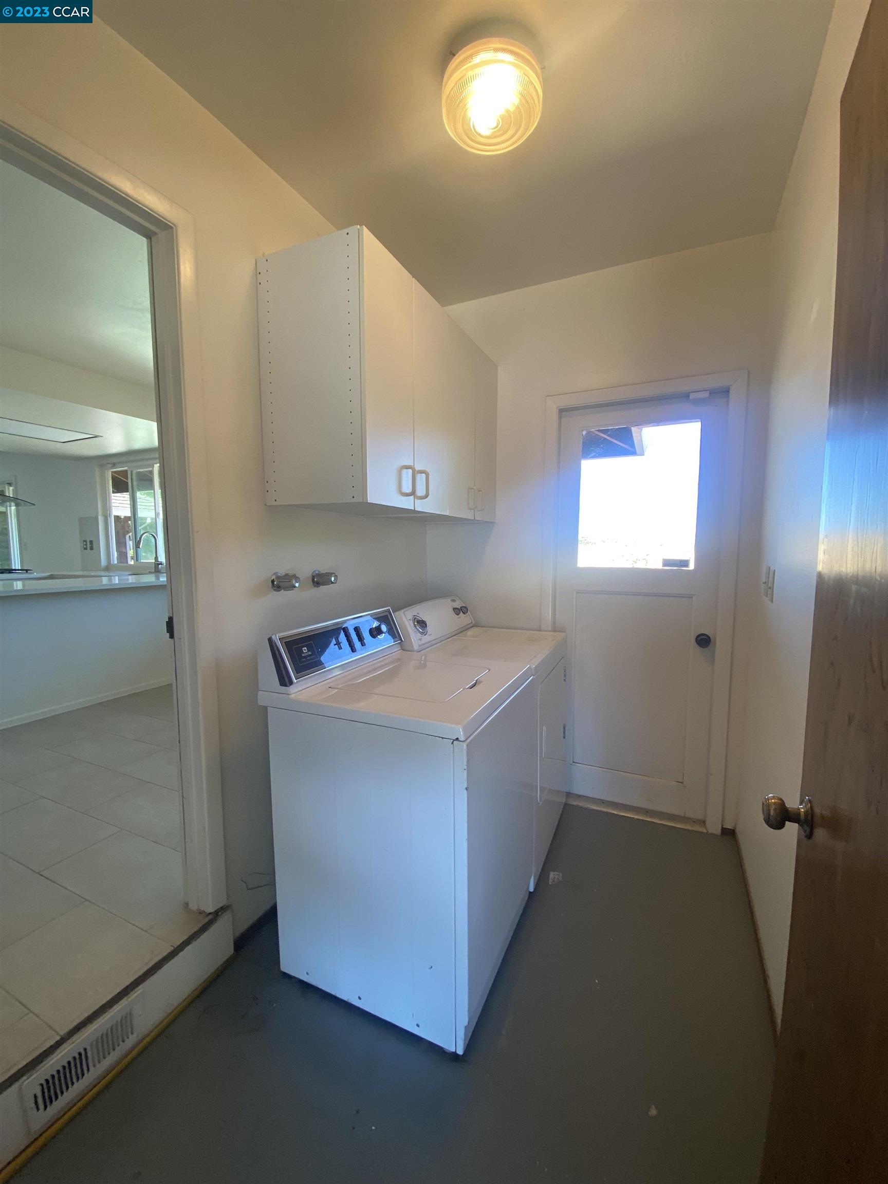 269 Birchwood Drive Moraga, CA 94556 - Photo 41 of 43 a utility room with washer and dryer