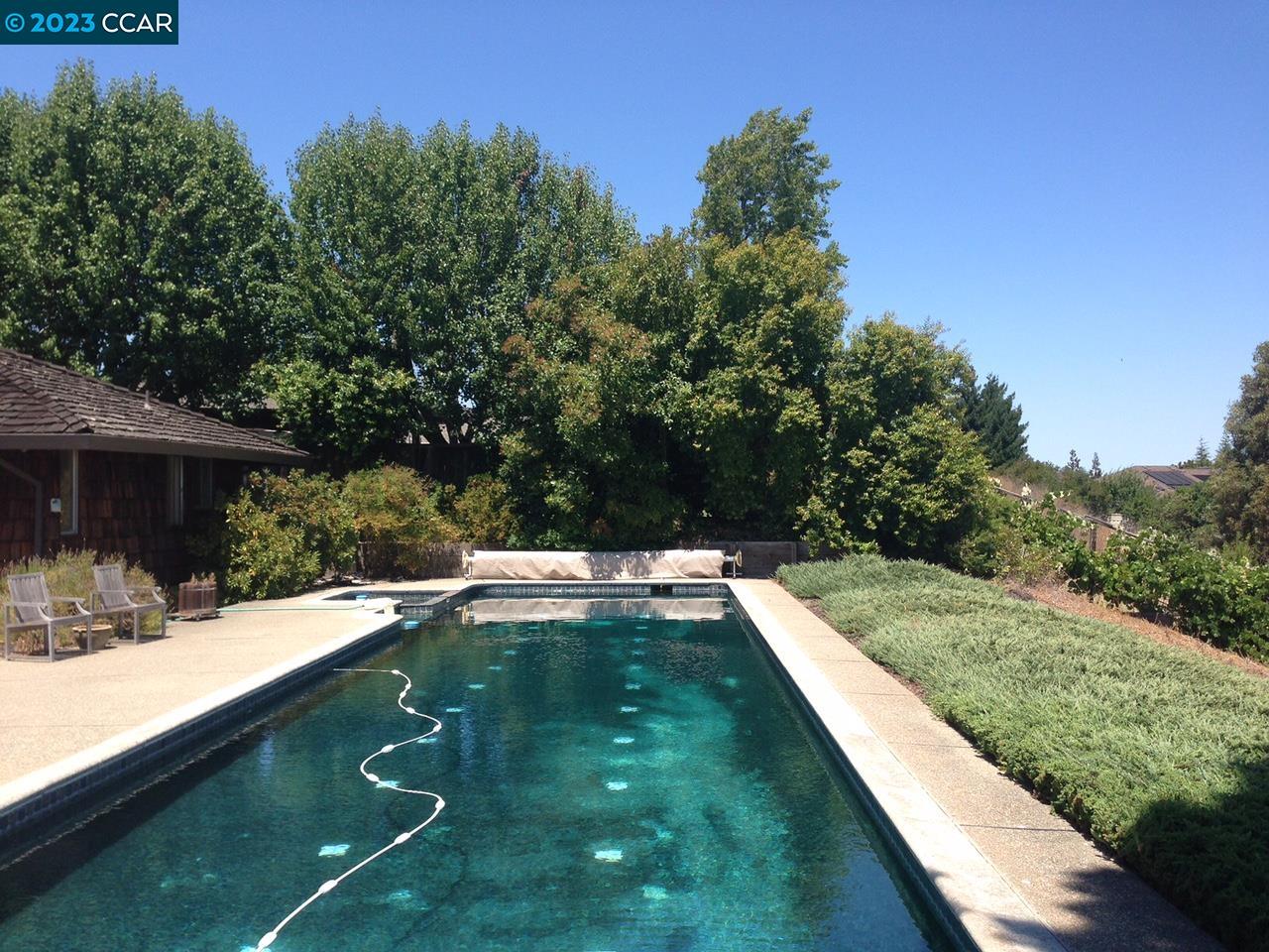 269 Birchwood Drive Moraga, CA 94556 - Photo 8 of 43 a view of a swimming pool with a yard