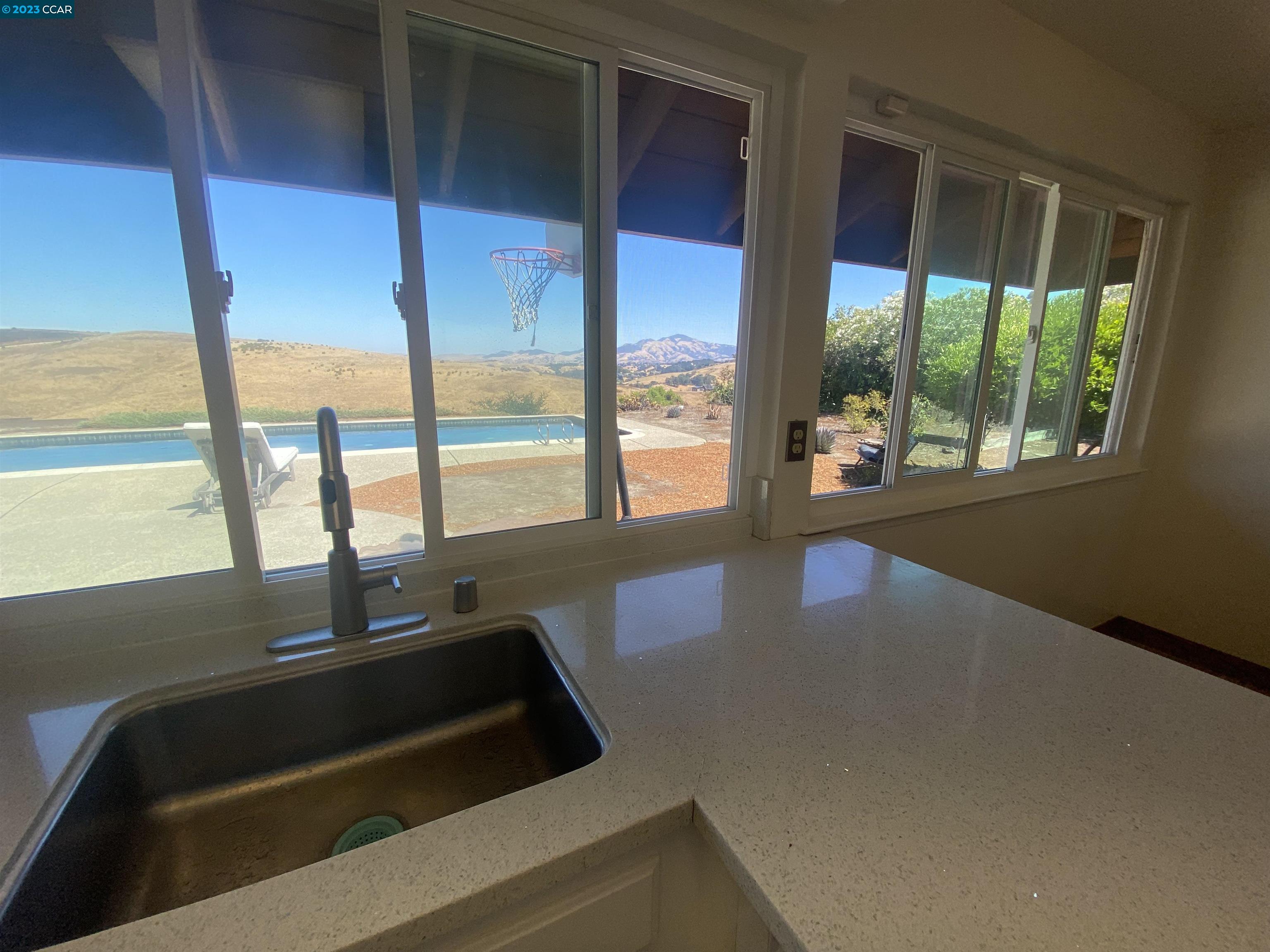 269 Birchwood Drive Moraga, CA 94556 - Photo 10 of 43 a kitchen with large windows and a sink