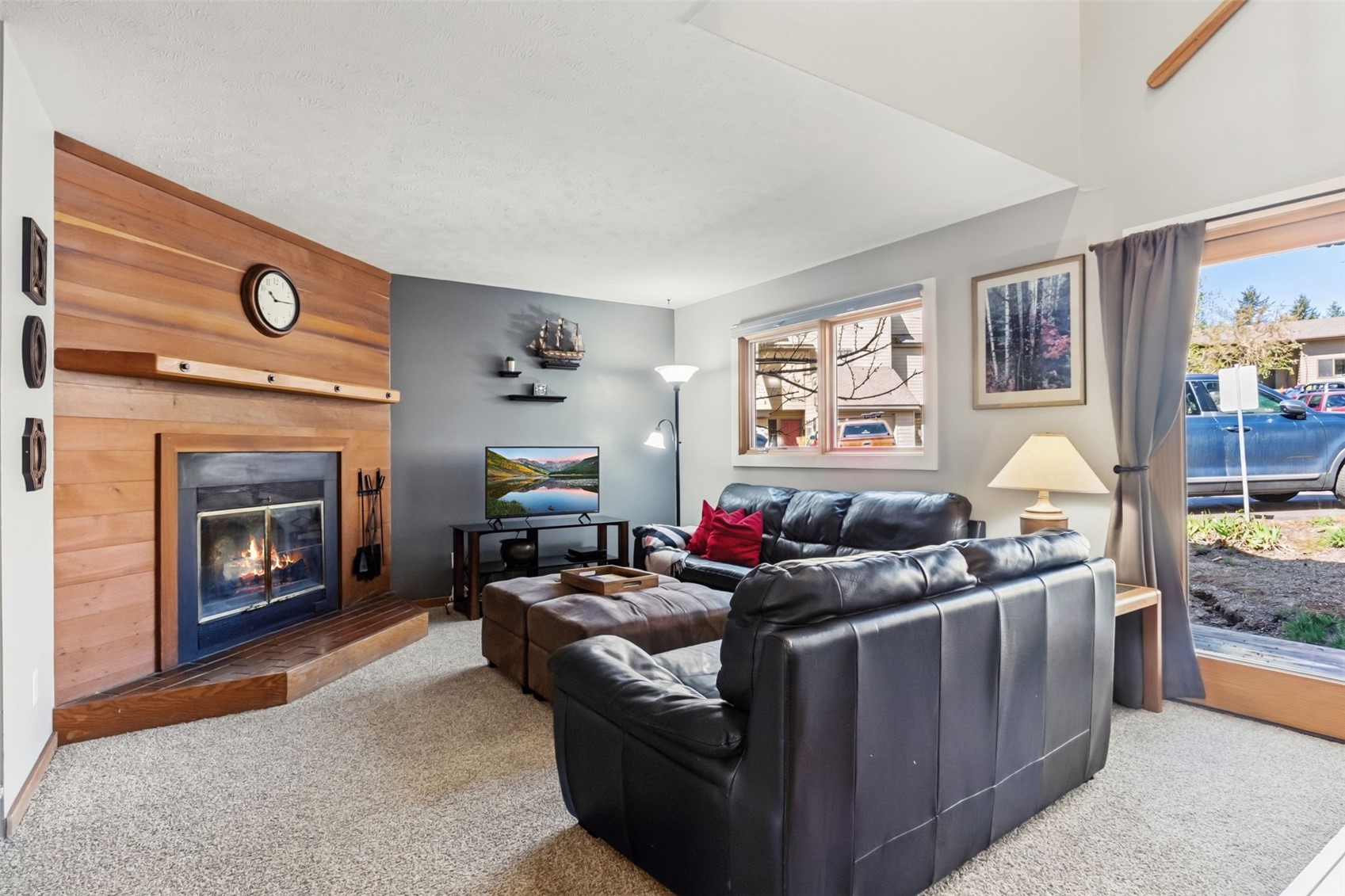 6734 Ryan Gulch Road, Unit 6734 Silverthorne, CO 80498 - Photo 5 of 33 a living room with furniture and a fireplace
