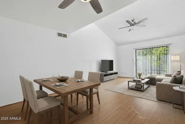 a view of a livingroom with furniture and a window
