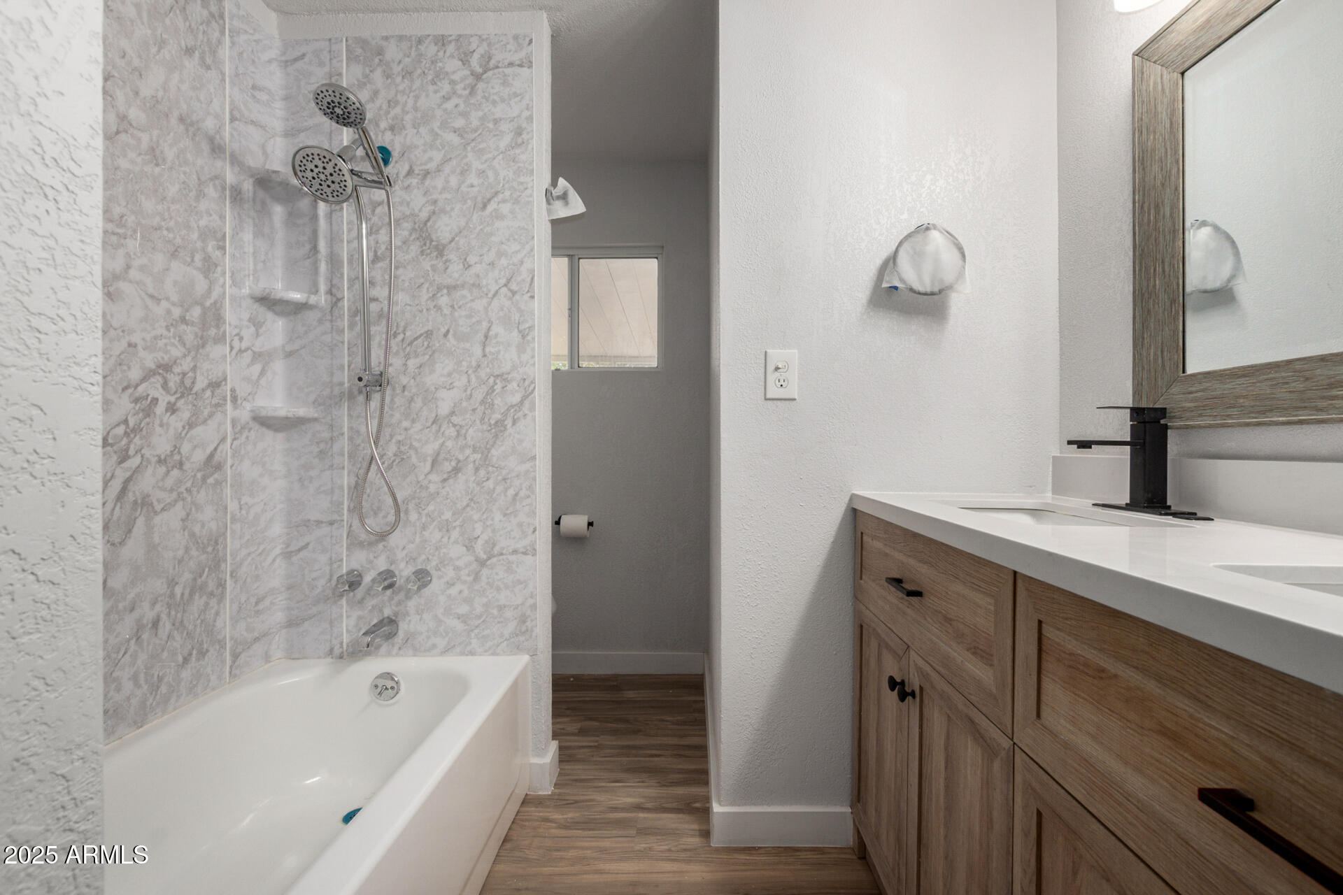 2050 West Dunlap Avenue, Unit D42 Phoenix, AZ 85021 - Photo 16 of 30 a bathroom with a tub sink vanity granite and shower
