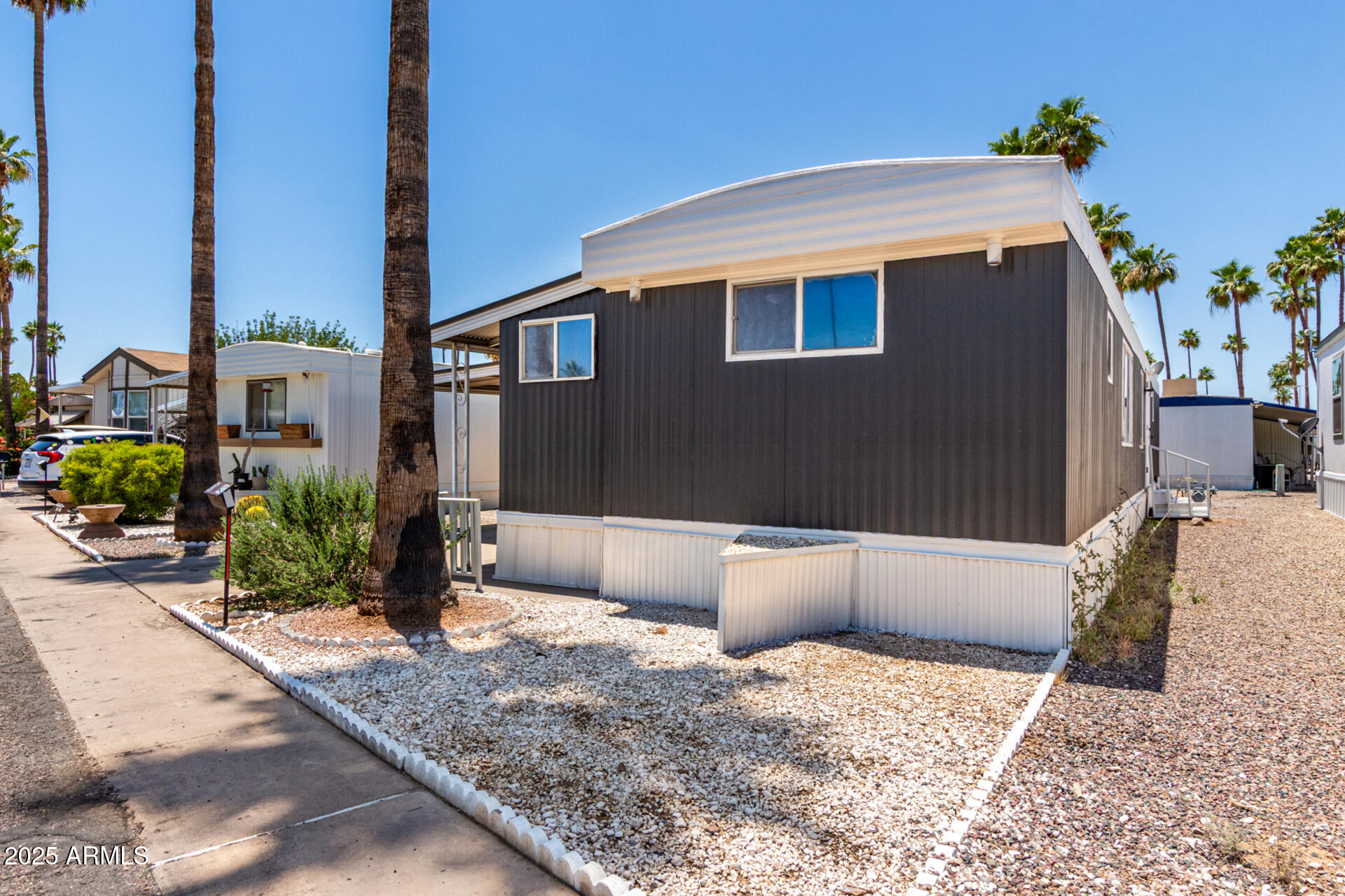 2050 West Dunlap Avenue, Unit D42 Phoenix, AZ 85021 - Photo 27 of 30 a front view of a house with a yard