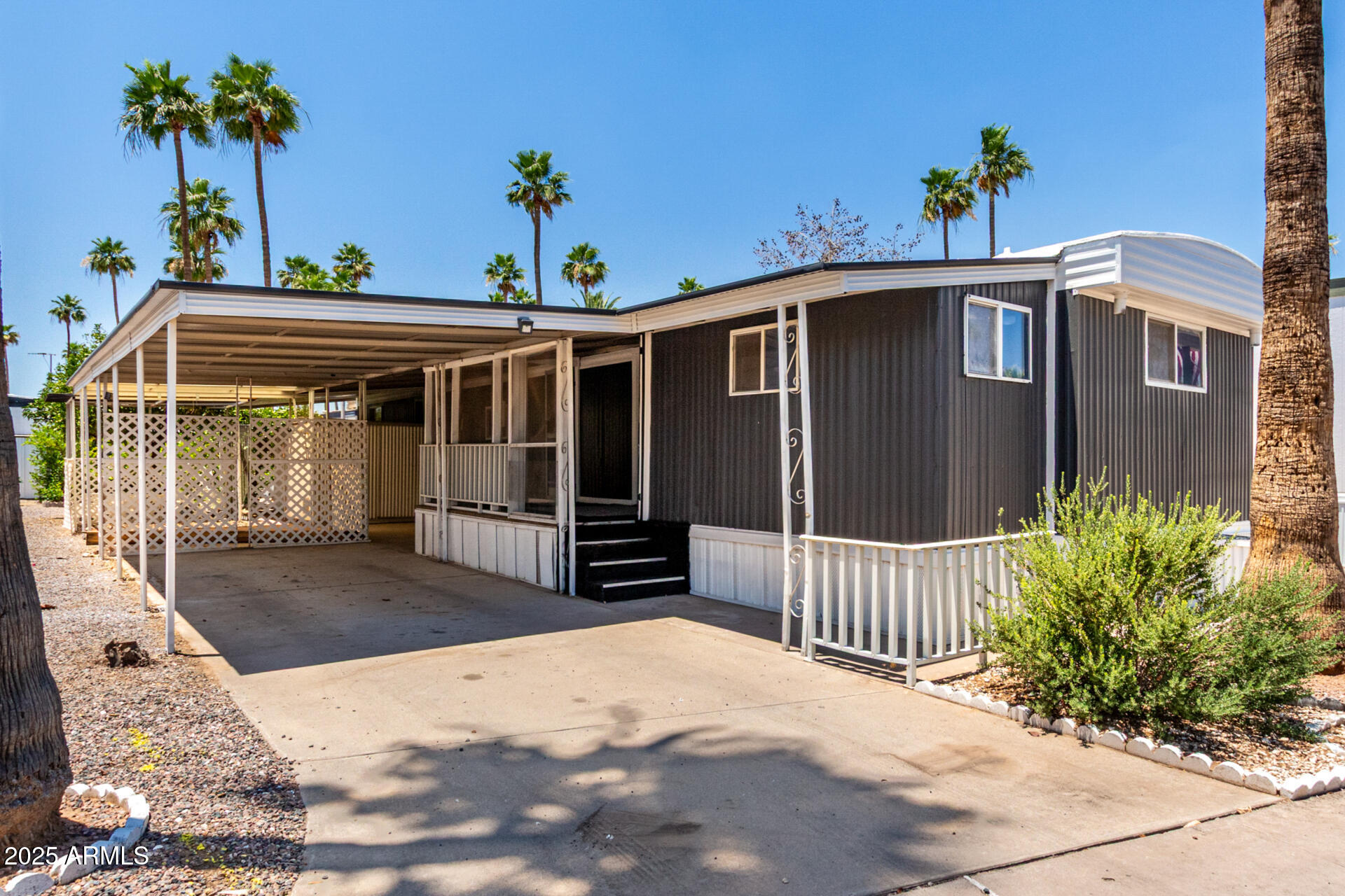2050 West Dunlap Avenue, Unit D42 Phoenix, AZ 85021 - Photo 28 of 30 a front view of a house with a yard
