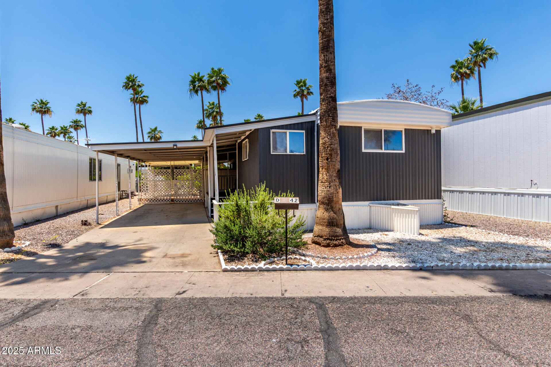 2050 West Dunlap Avenue, Unit D42 Phoenix, AZ 85021 - Photo 29 of 30 a front view of a house with a yard