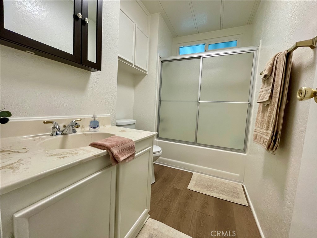 31130 South General Kearny Road, Unit 145 Temecula, CA 92591 - Photo 13 of 27 a bathroom with a sink and mirror