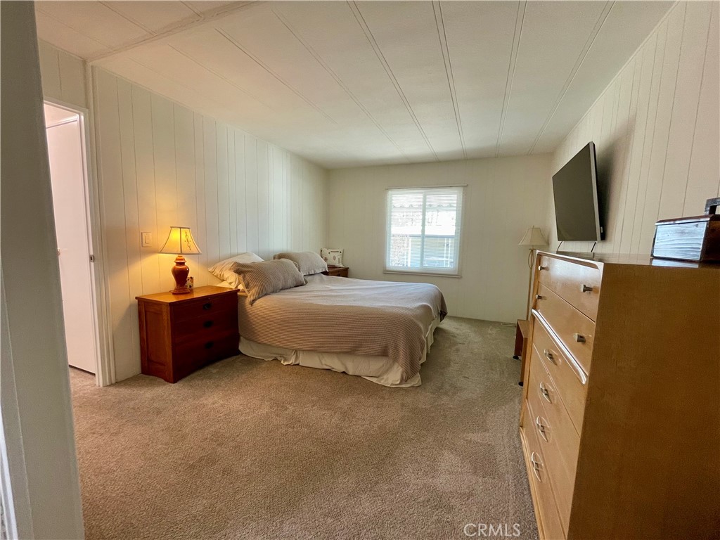 31130 South General Kearny Road, Unit 145 Temecula, CA 92591 - Photo 15 of 27 a bed room with a bed and a television