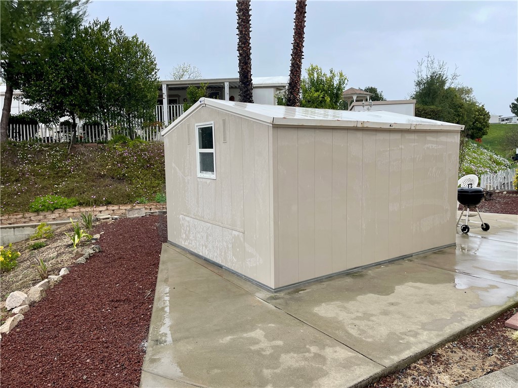 31130 South General Kearny Road, Unit 145 Temecula, CA 92591 - Photo 20 of 27 a view of a house with backyard