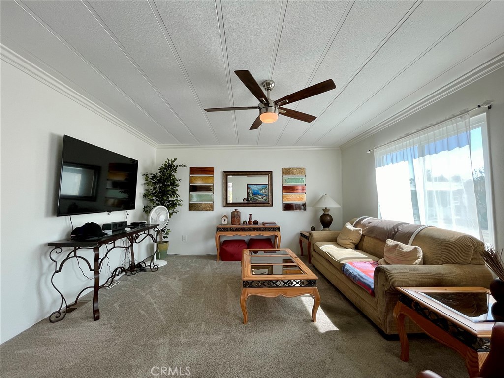 31130 South General Kearny Road, Unit 145 Temecula, CA 92591 - Photo 7 of 27 a living room with furniture and a flat screen tv