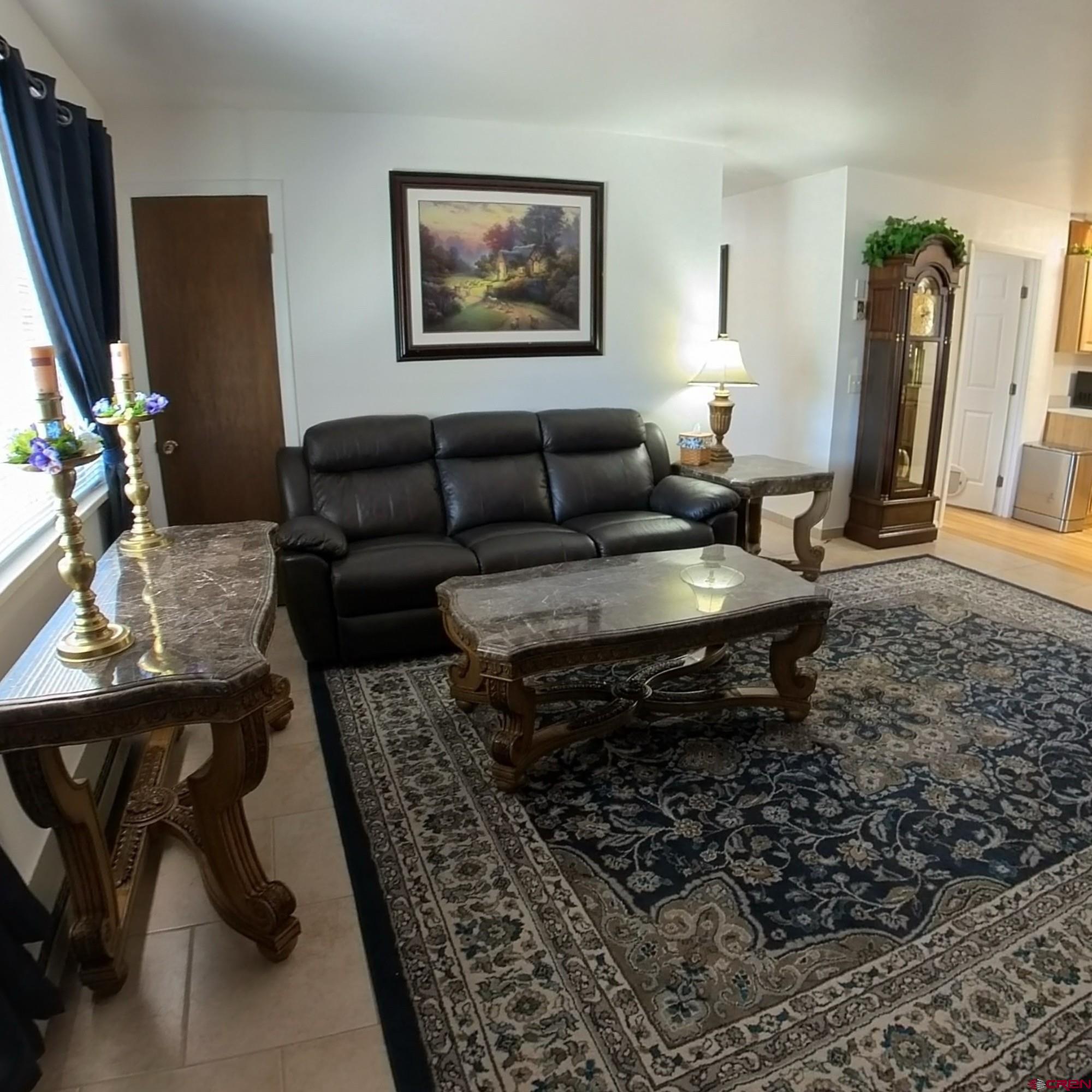 12365 East Spring Circle Eckert, CO 81418 - Photo 11 of 34 a living room with furniture and a flat screen tv