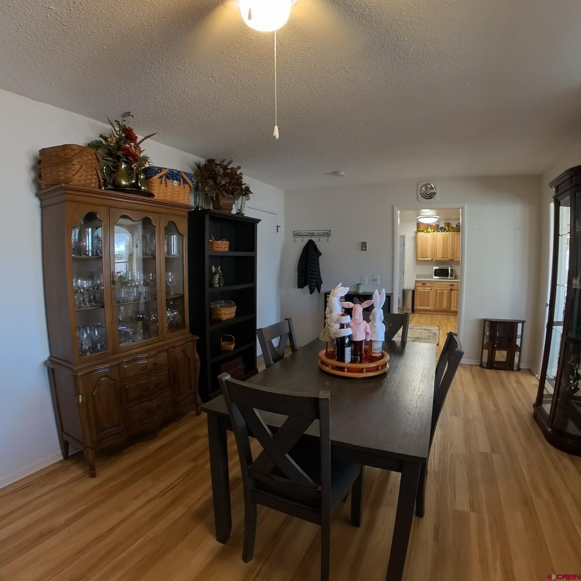 12365 East Spring Circle Eckert, CO 81418 - Photo 14 of 34 a view of a dining room with furniture and wooden floor