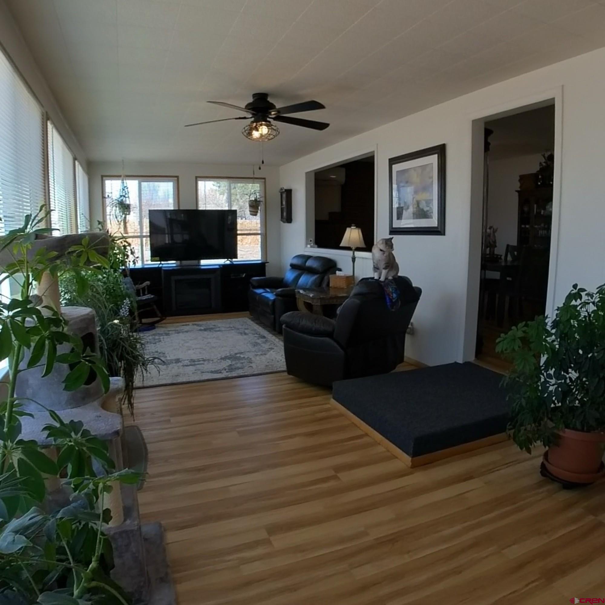 12365 East Spring Circle Eckert, CO 81418 - Photo 15 of 34 a living room with furniture and a flat screen tv