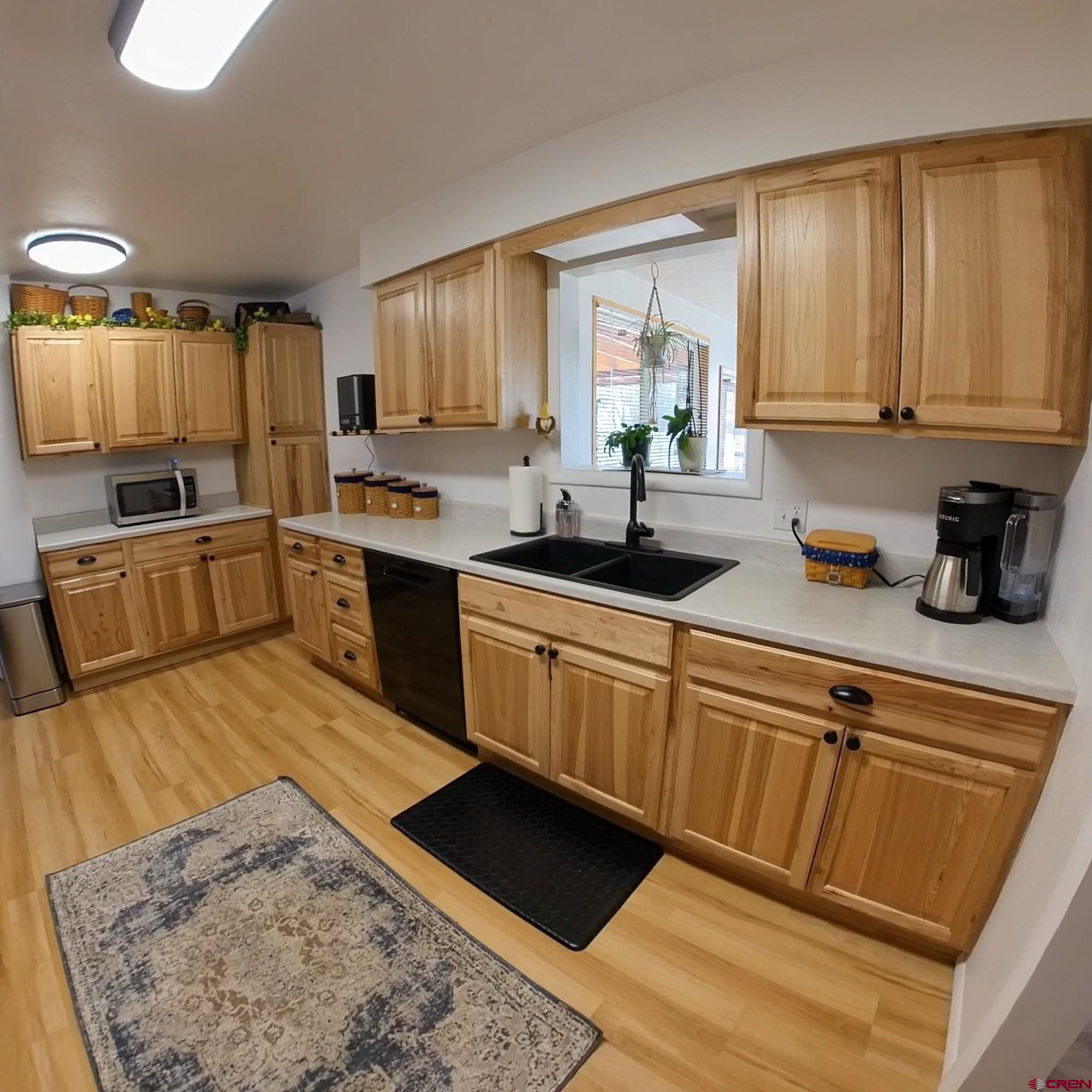 12365 East Spring Circle Eckert, CO 81418 - Photo 17 of 34 a kitchen with a sink stove and refrigerator