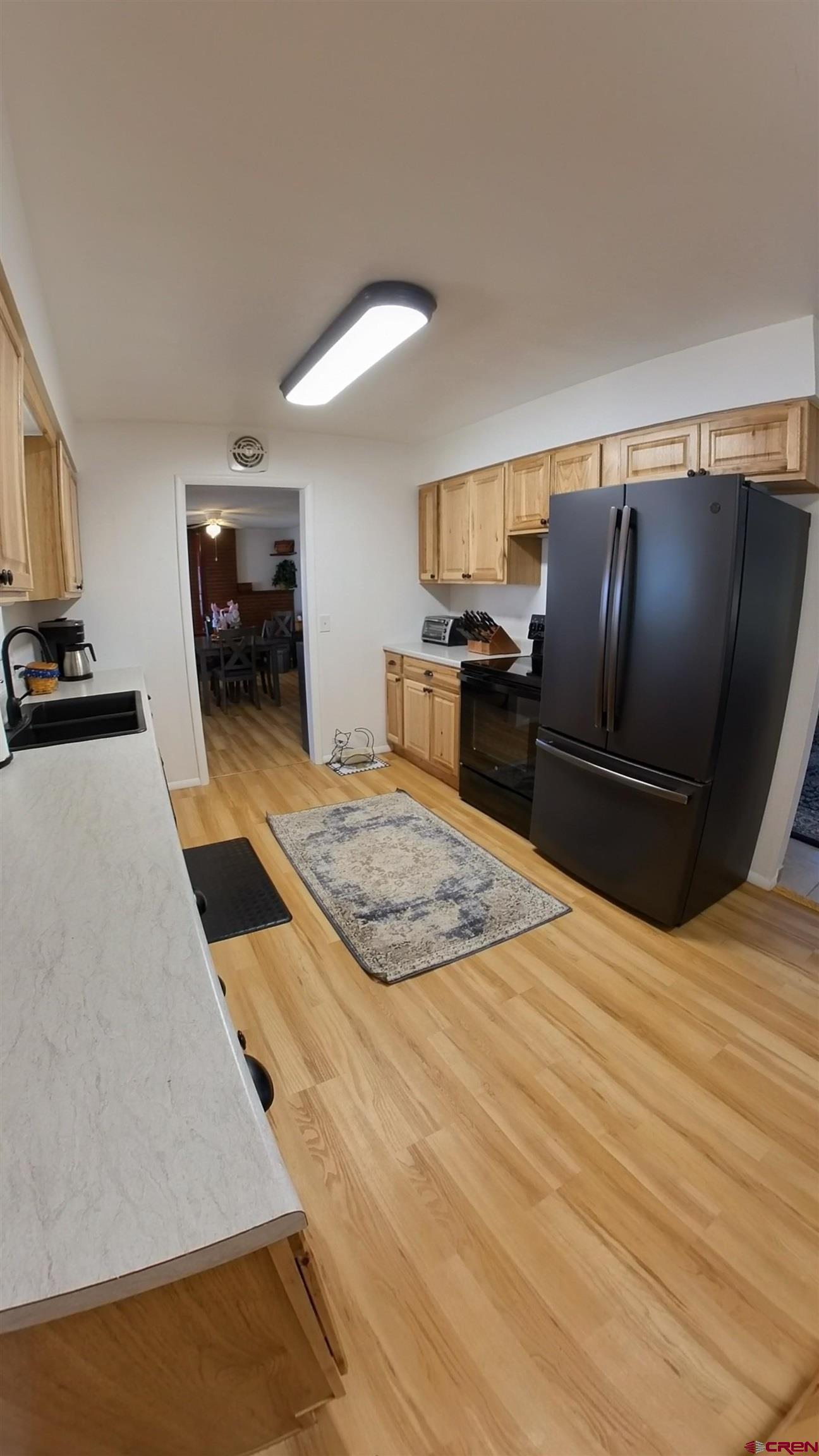 12365 East Spring Circle Eckert, CO 81418 - Photo 18 of 34 a kitchen with granite countertop a refrigerator stove and oven