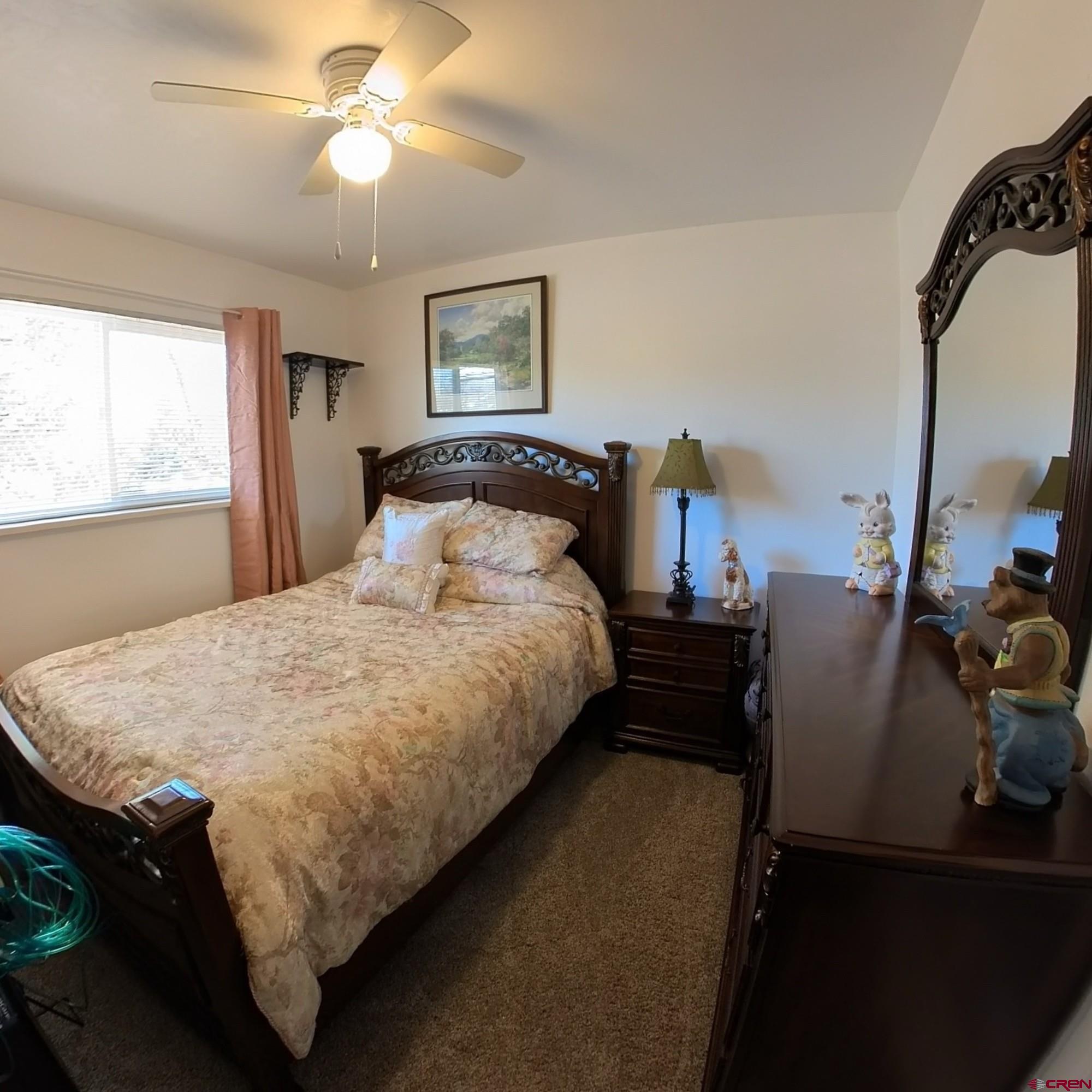 12365 East Spring Circle Eckert, CO 81418 - Photo 20 of 34 a bed sitting in a bedroom next to a window