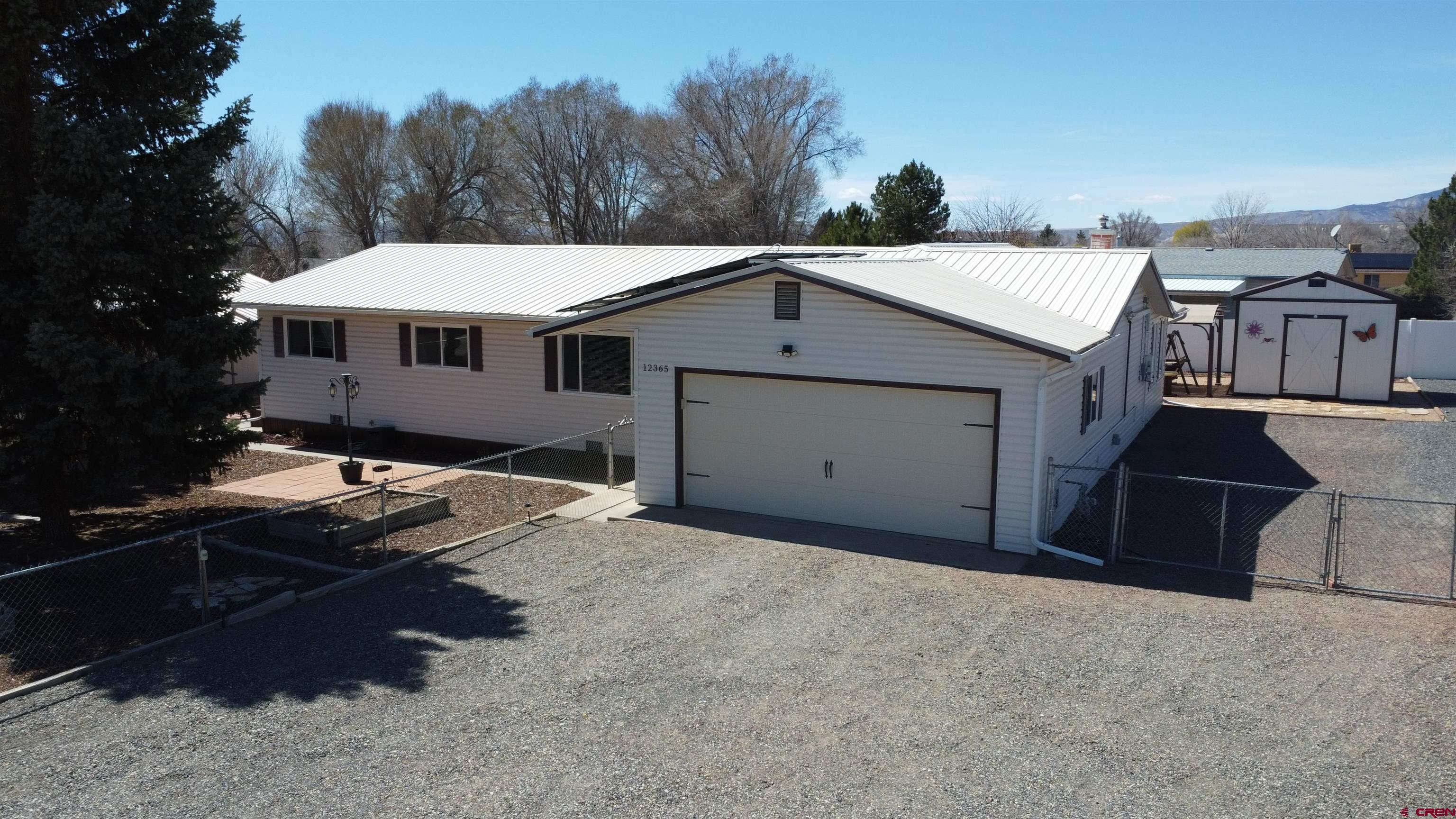 12365 East Spring Circle Eckert, CO 81418 - Photo 27 of 34 a view of a house with a backyard