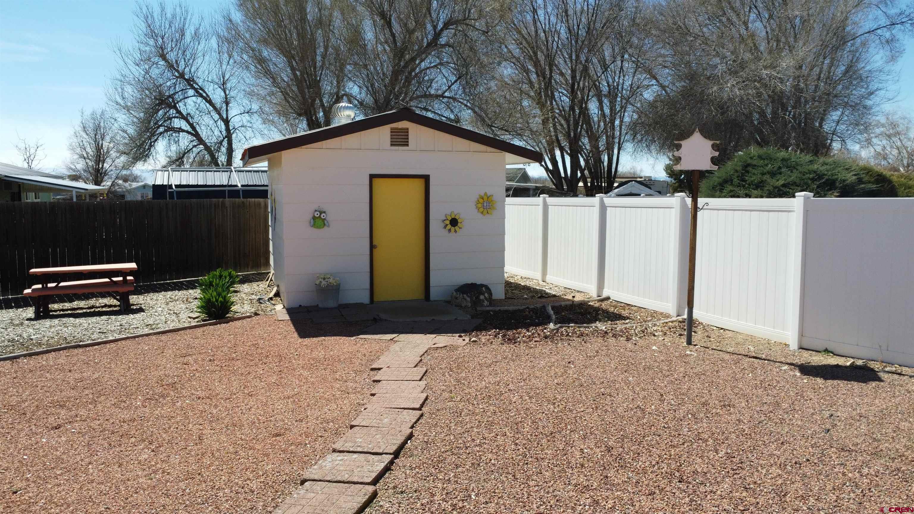 12365 East Spring Circle Eckert, CO 81418 - Photo 30 of 34 a front view of a house with trees