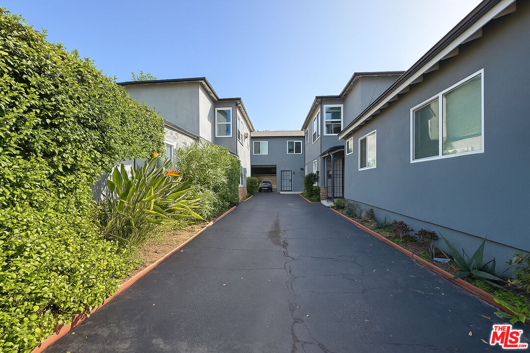 5244 Whitsett Avenue, Unit 1/4 Valley Village, CA 91607 - Photo 12 of 13 a view of a house with a yard and plant