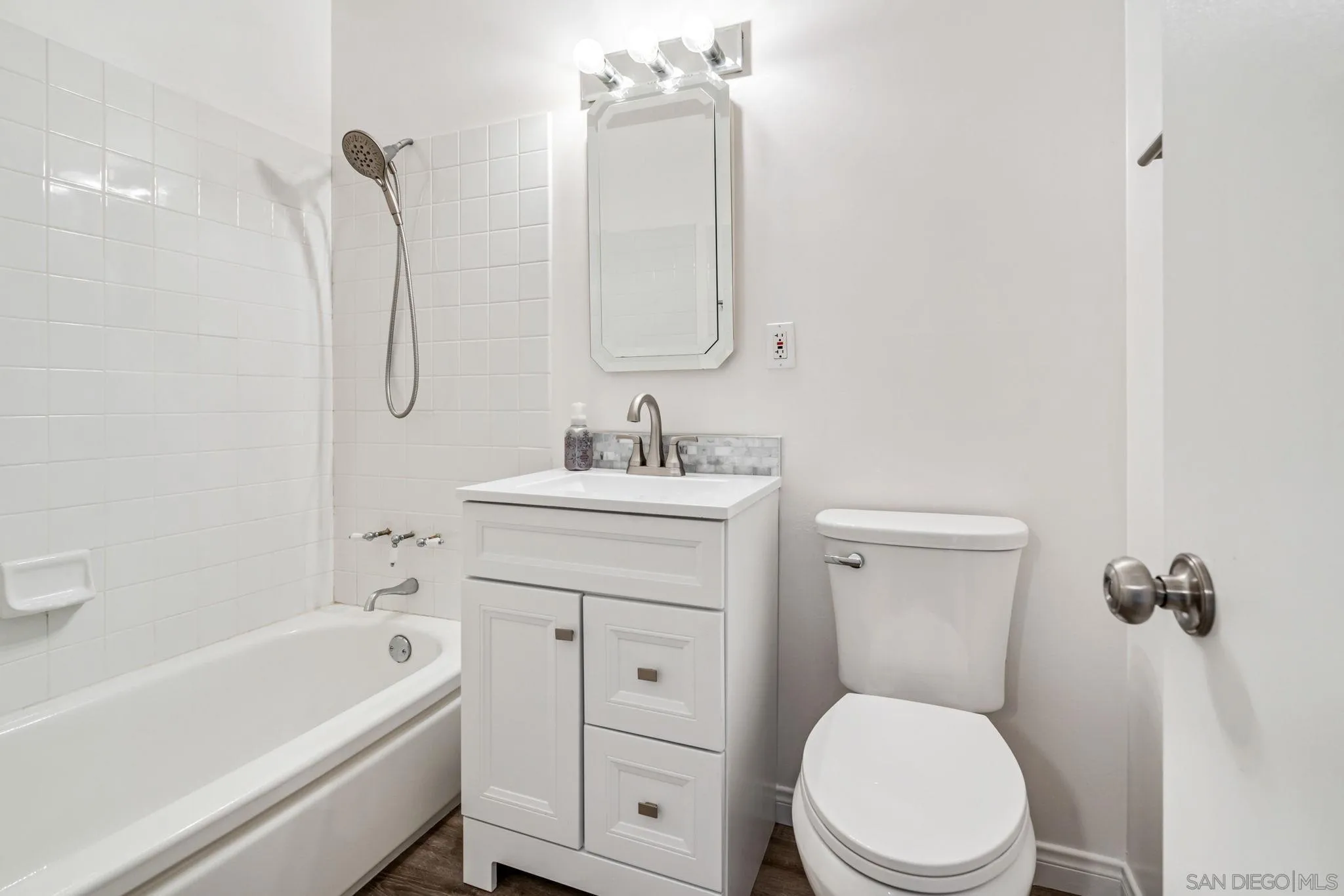 10330 Strathmore Drive Santee, CA 92071 - Photo 13 of 21 a bathroom with a sink a toilet and shower