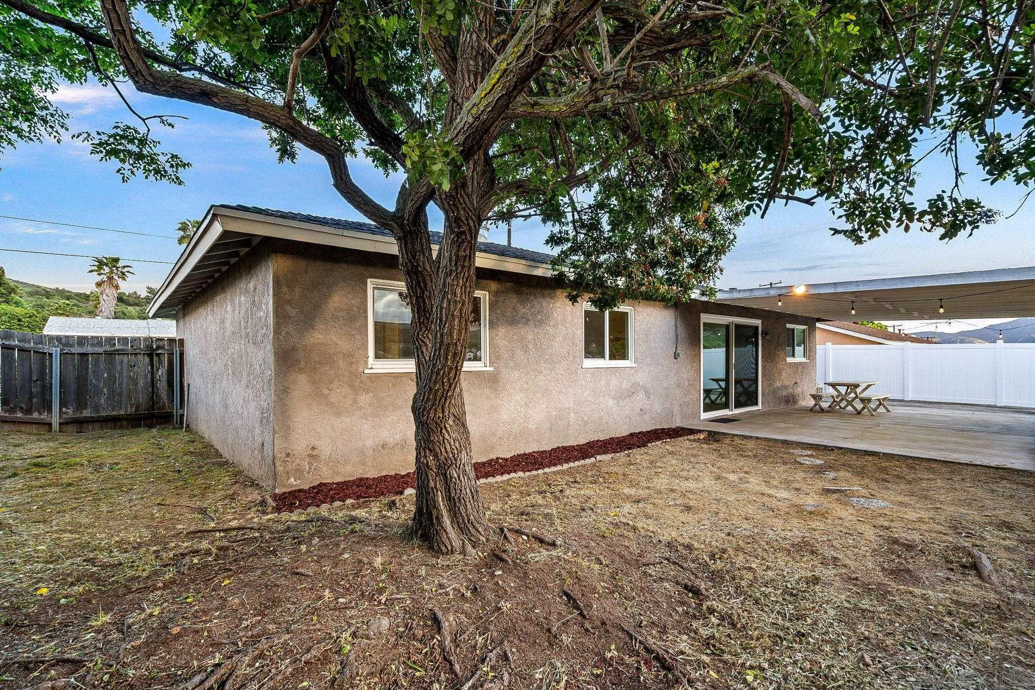 10330 Strathmore Drive Santee, CA 92071 - Photo 14 of 21 a house with trees in the background