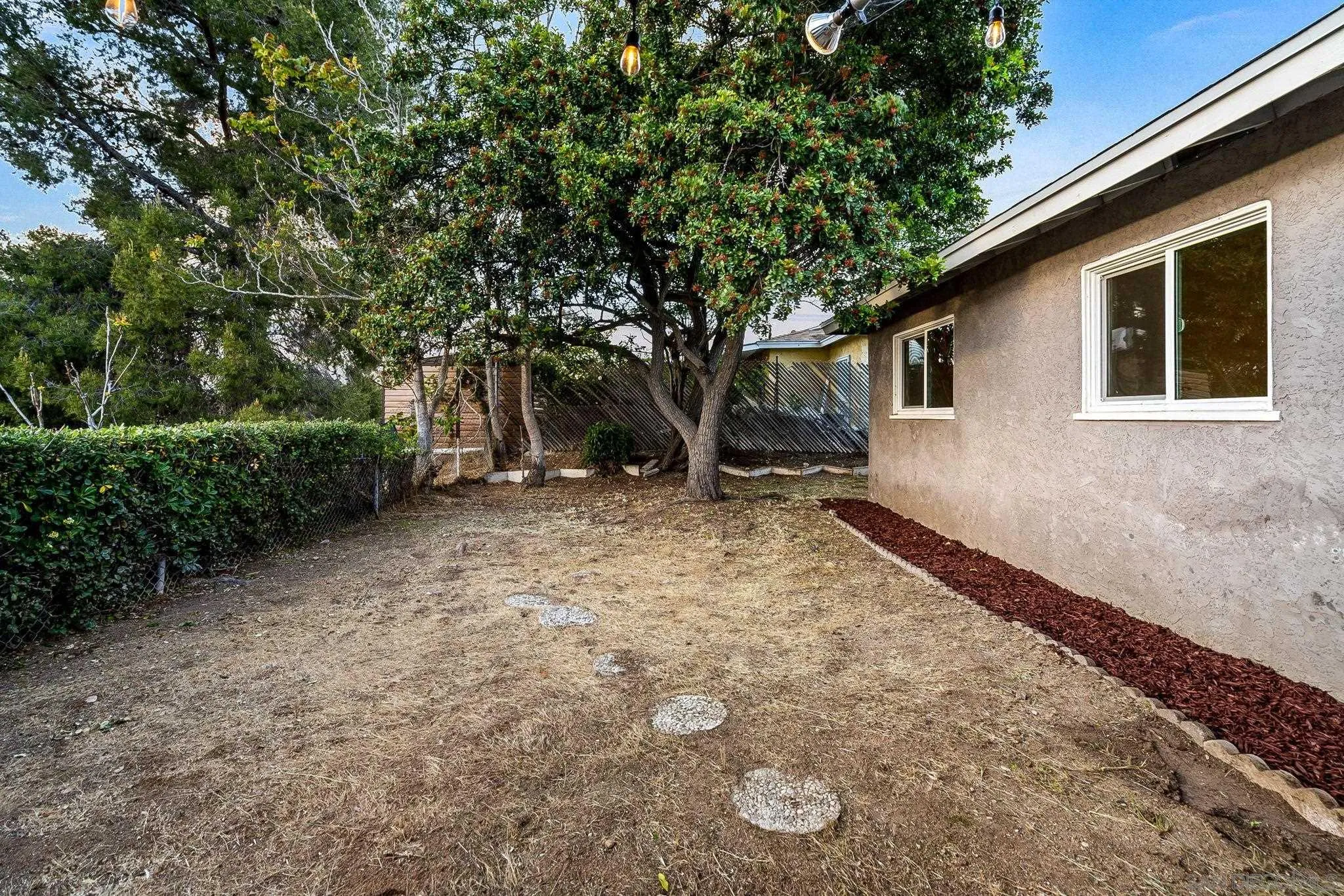 10330 Strathmore Drive Santee, CA 92071 - Photo 16 of 21 a backyard of a house with lots of green space