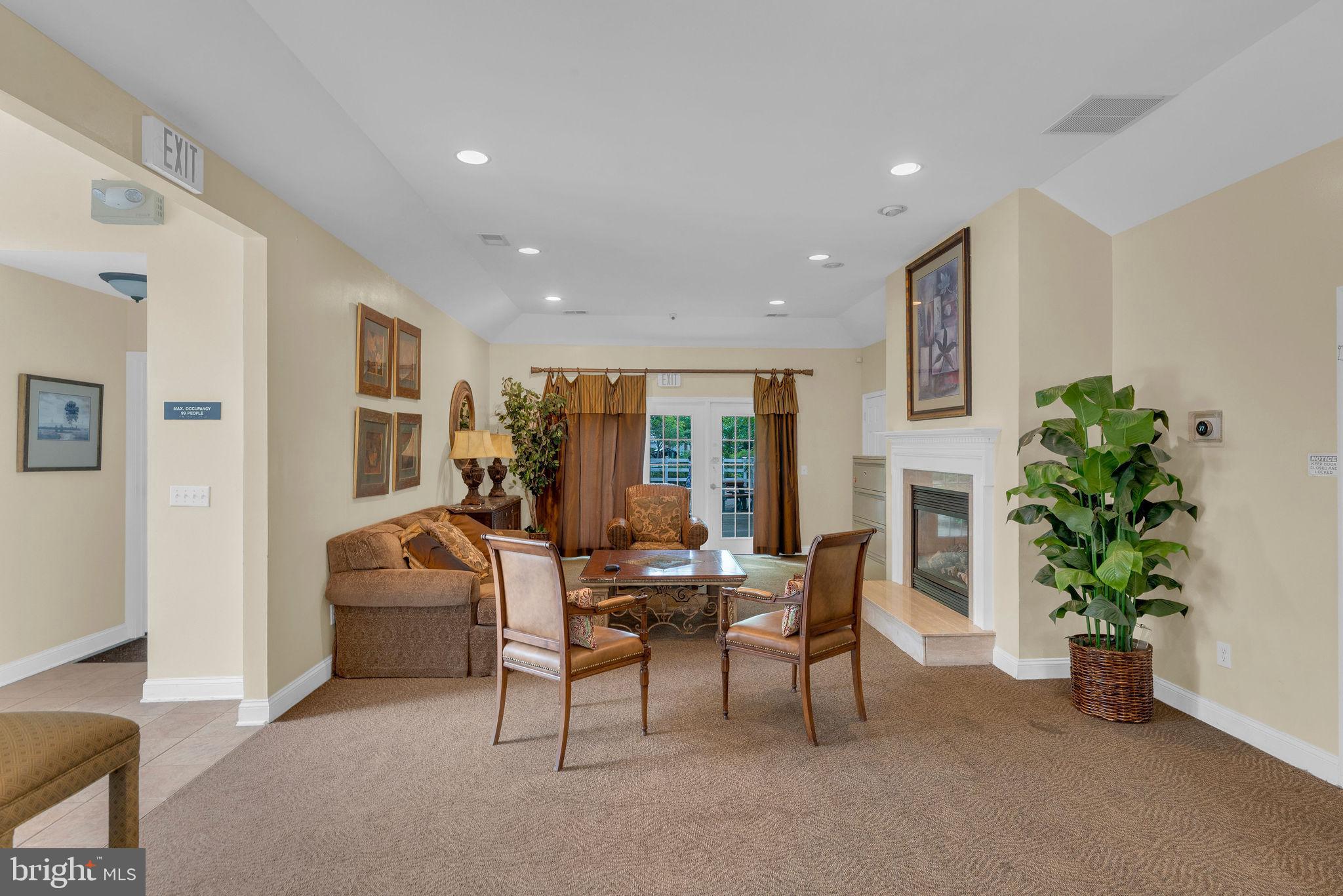 16 Cardiff Court Princeton Junction, NJ 08550 - Photo 50 of 60 a living room with furniture and a potted plant