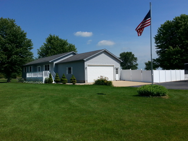 2419 Quarry Road Ashton, IL 61006 - Photo 2 of 25 a front view of house with a garden and trees