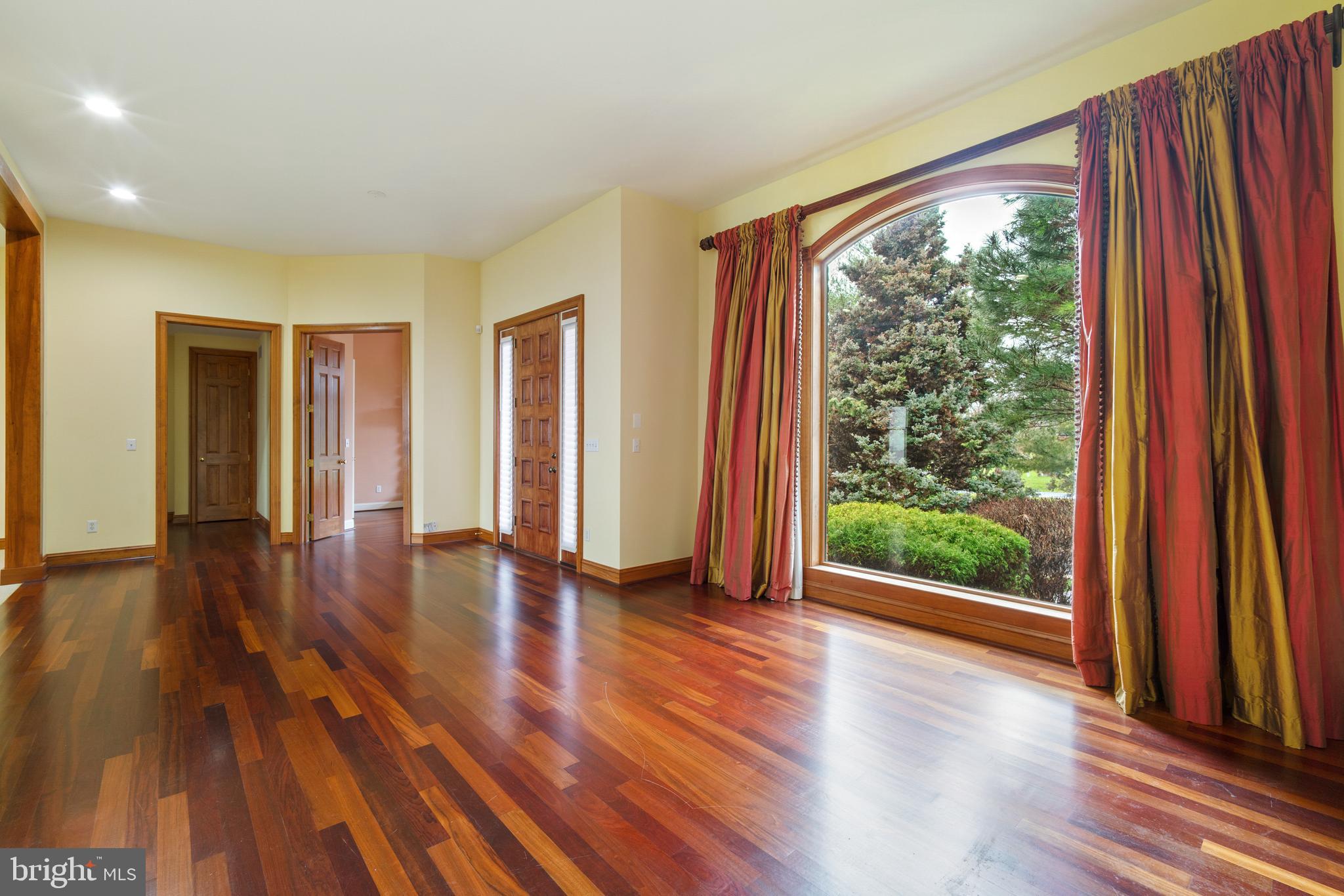 2817 Cox Neck Road Chester, MD 21619 - Photo 11 of 35 a view of an entryway with wooden floor and door