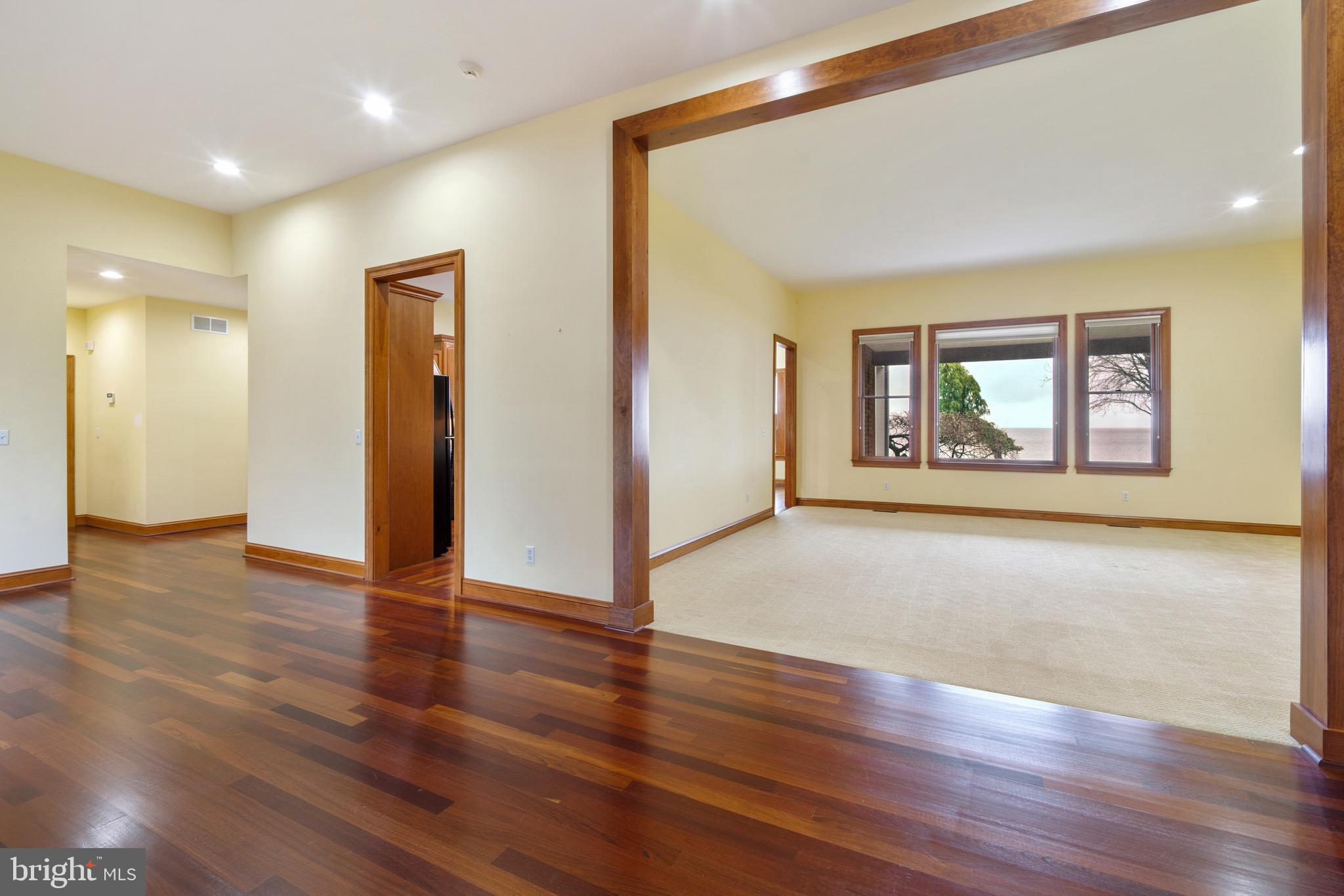 2817 Cox Neck Road Chester, MD 21619 - Photo 12 of 35 a view of an empty room with wooden floor and a window