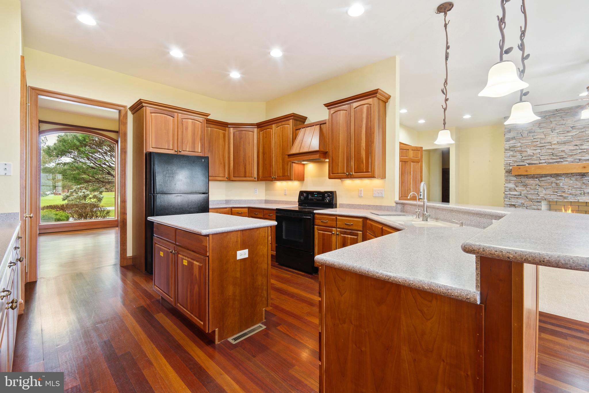 2817 Cox Neck Road Chester, MD 21619 - Photo 16 of 35 a kitchen with stainless steel appliances granite countertop a sink a stove and a refrigerator