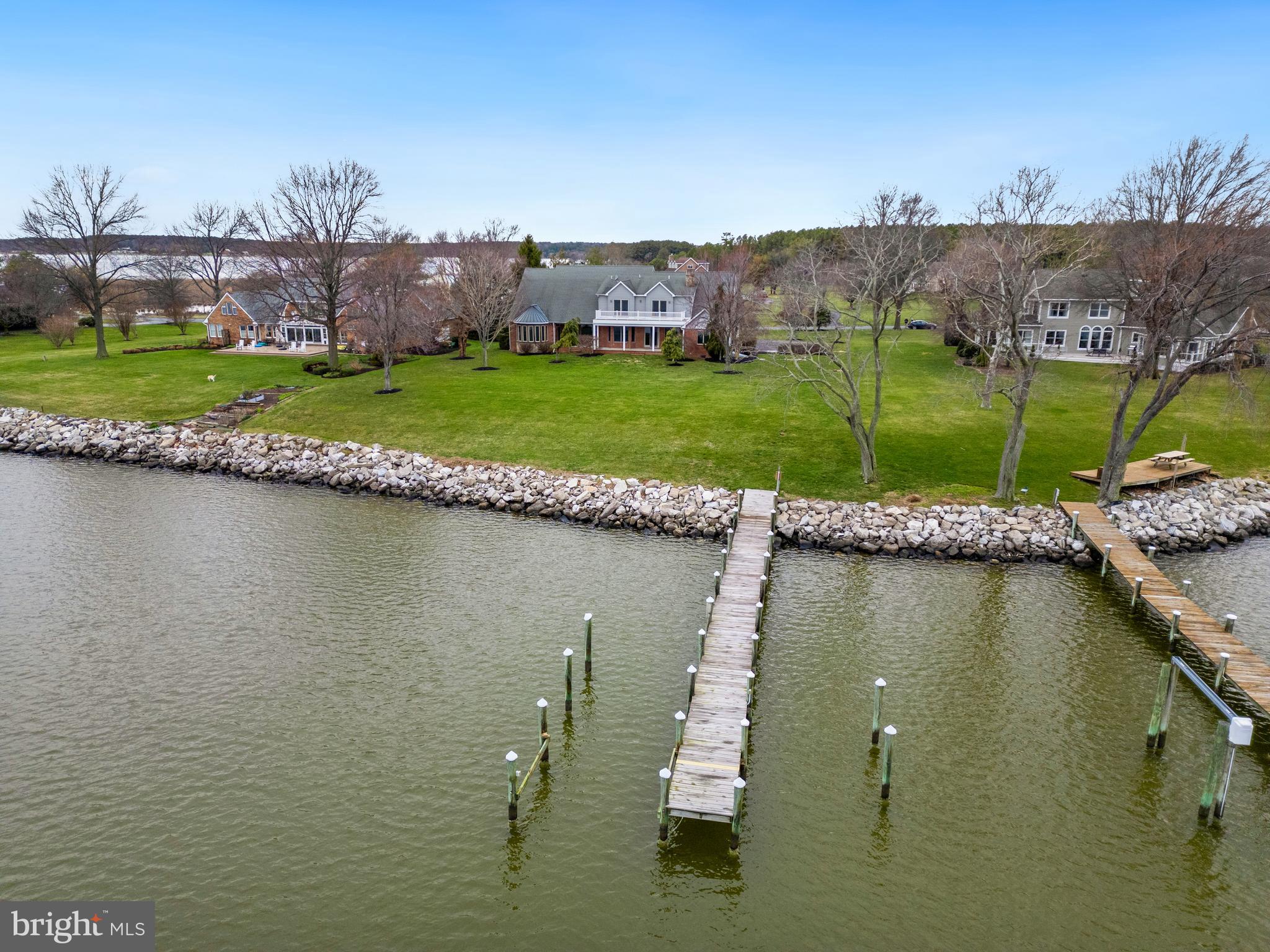 2817 Cox Neck Road Chester, MD 21619 - Photo 5 of 35 a view of a lake with a house in the background