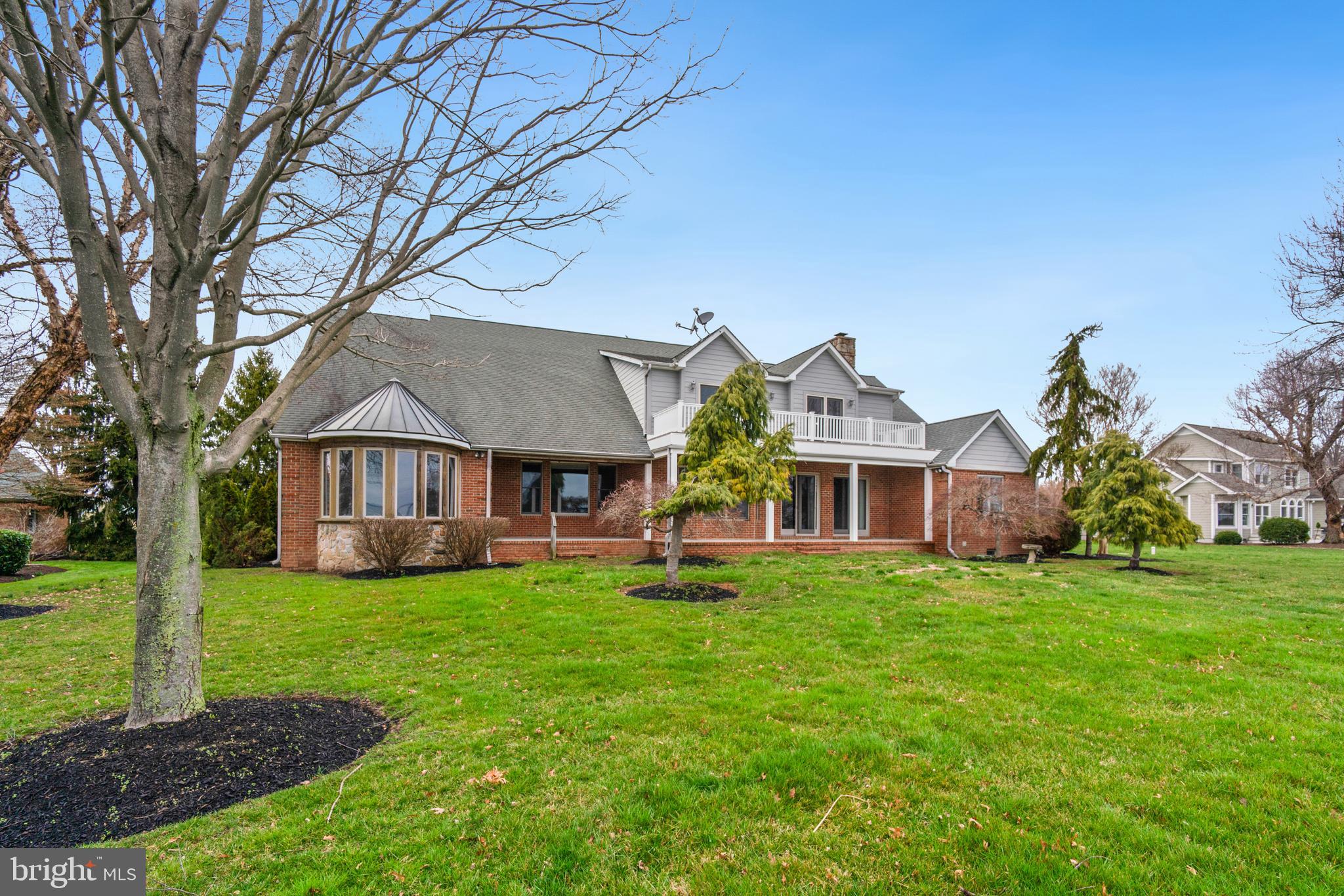 2817 Cox Neck Road Chester, MD 21619 - Photo 6 of 35 a front view of a house with a yard
