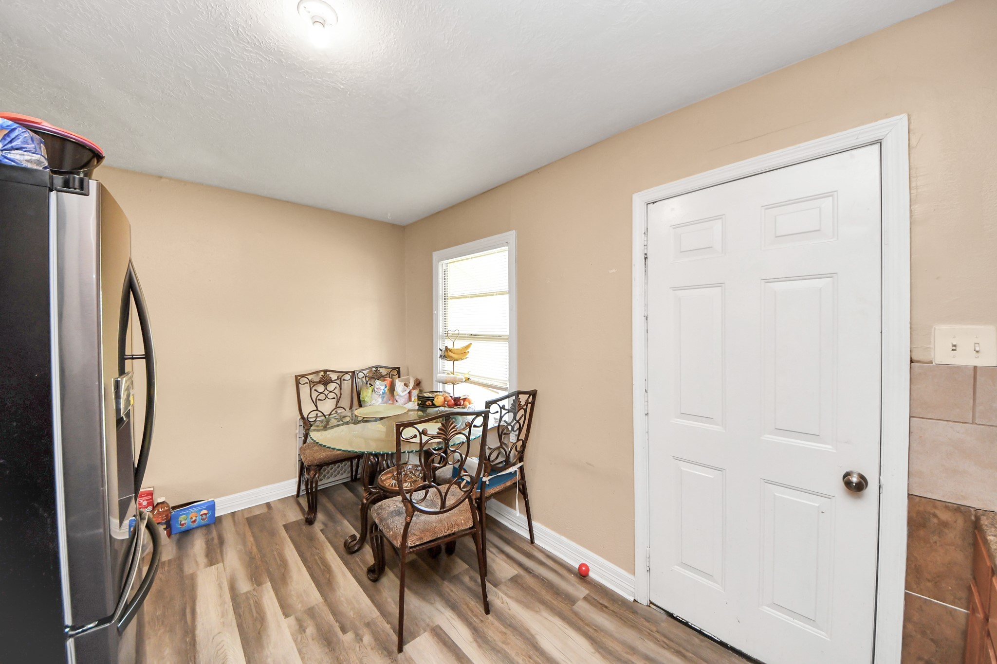11025 Muscatine Street Houston, TX 77029 - Photo 11 of 33 a view of a dining room with furniture and a window
