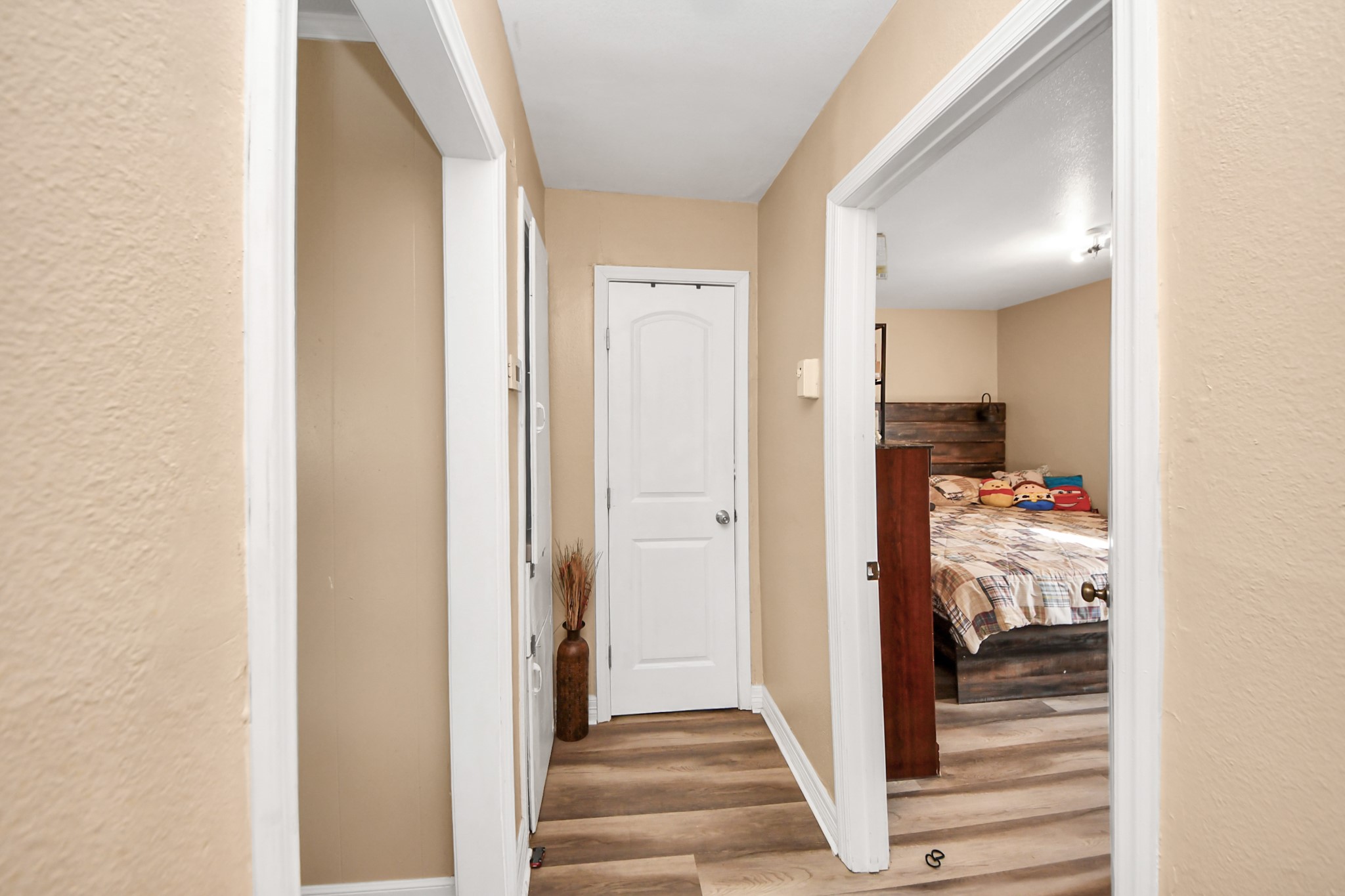 11025 Muscatine Street Houston, TX 77029 - Photo 12 of 33 a view of a hallway with wooden floor and entryway