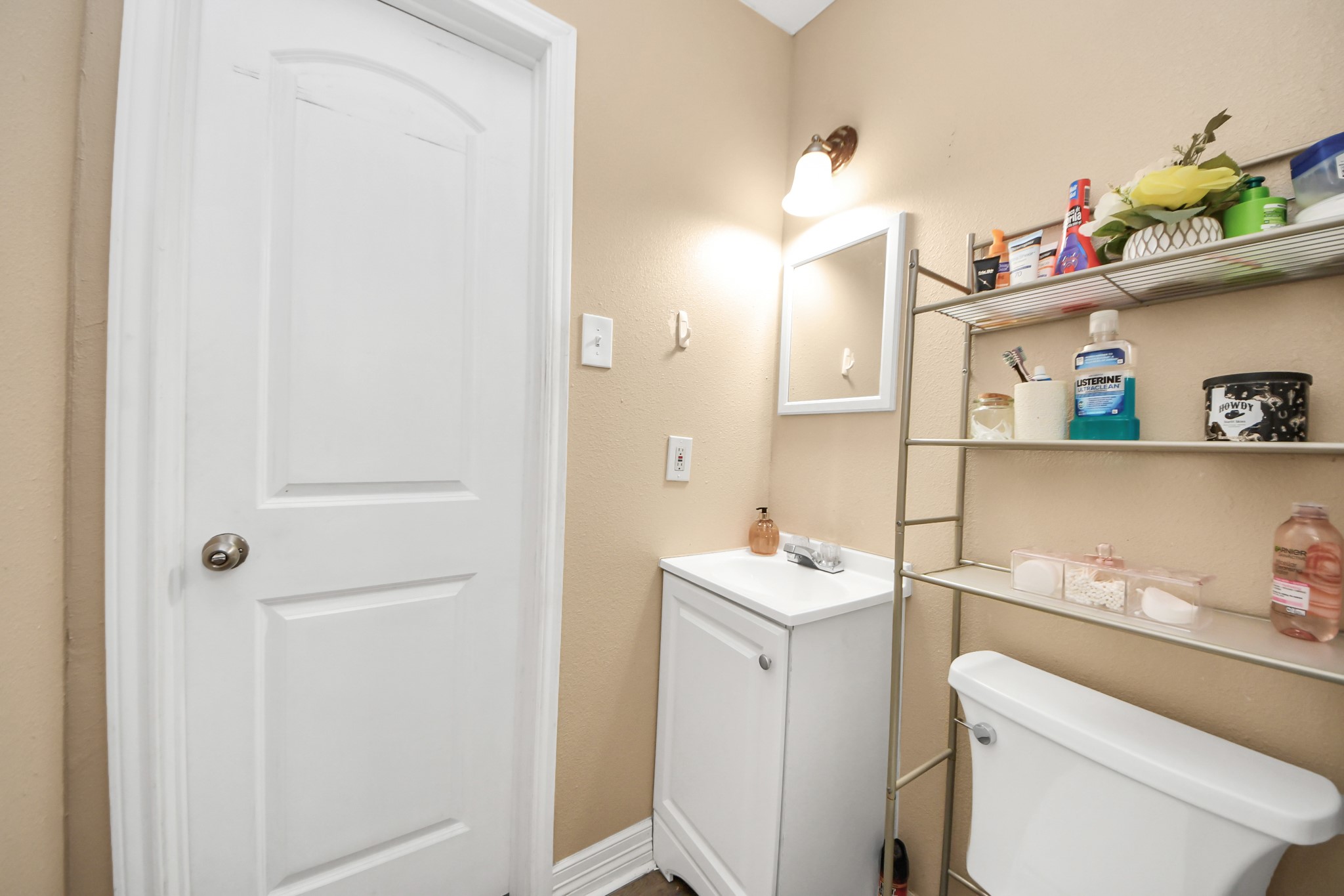11025 Muscatine Street Houston, TX 77029 - Photo 16 of 33 a bathroom with a sink a toilet and vanity